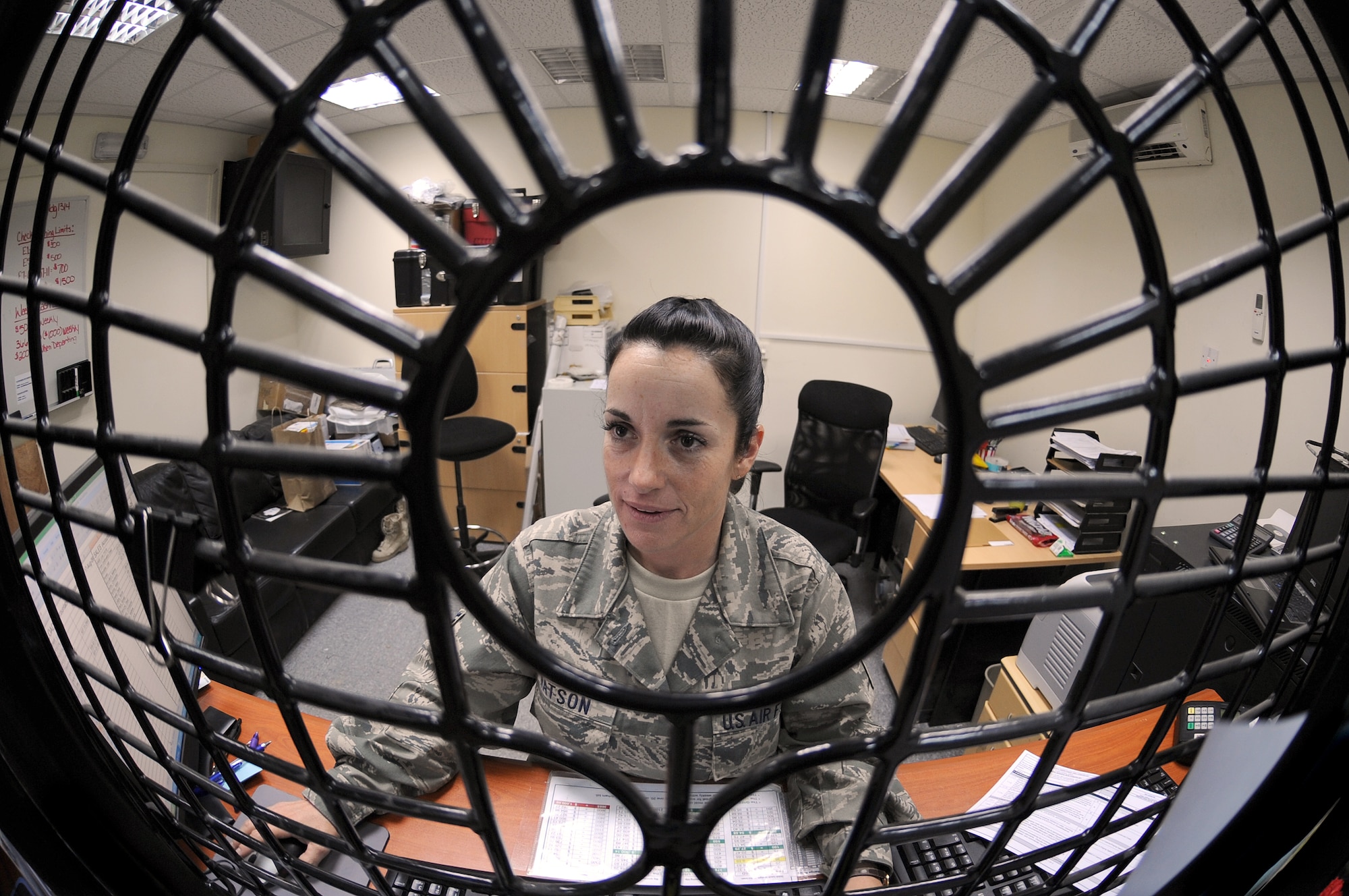 SOUTHWEST ASIA -Staff Sgt. Keri Watson, 380th Air Expeditionary Wing Finance Office, provides customers with financial assistance Aug. 17. Sergeant Watson is deployed from the 162nd Fighter Wing, and hails from Tucson, Ariz. (U.S. Air Force photo/Tech. Sgt. Charles Larkin Sr)