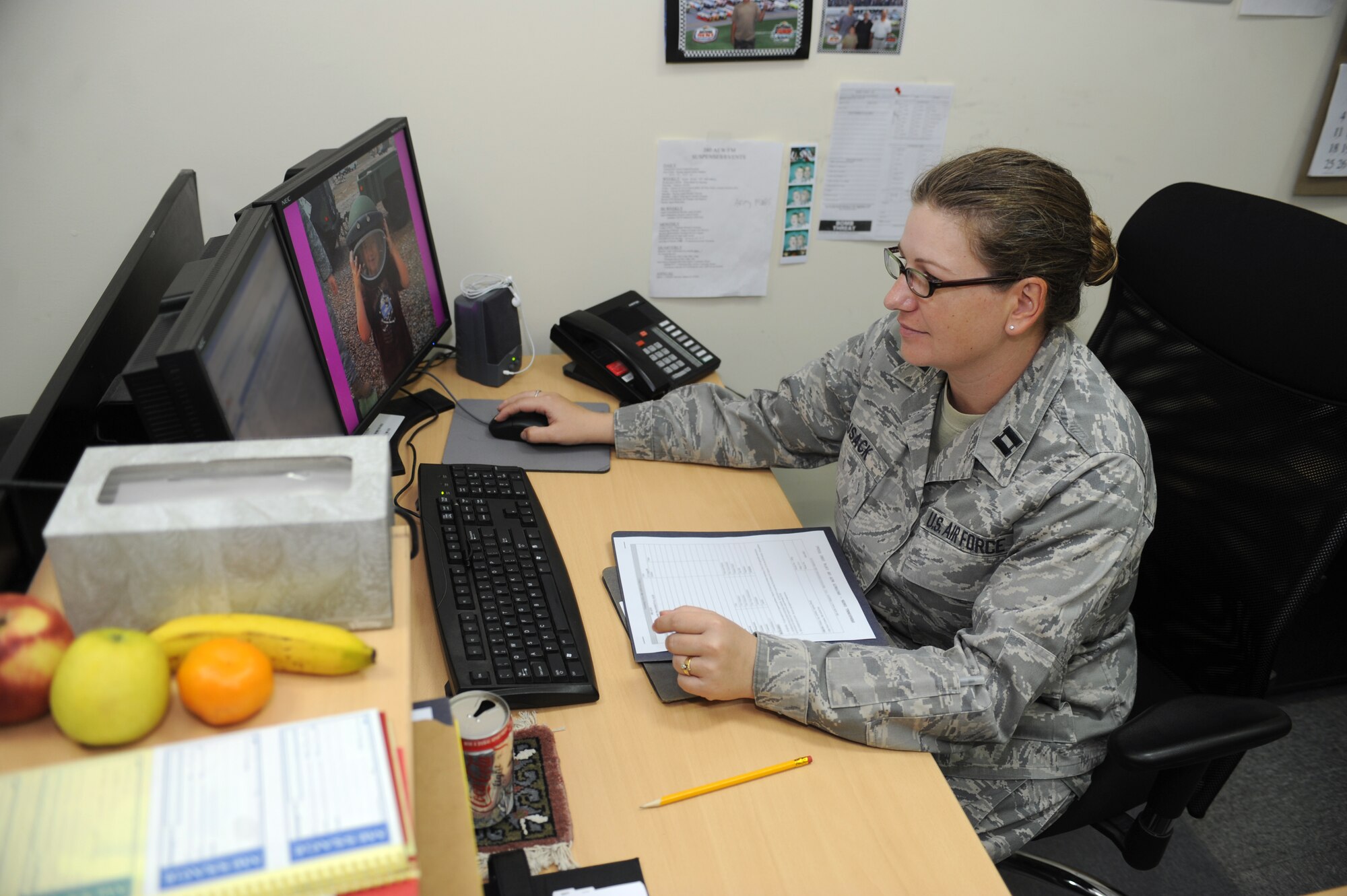 SOUTHWEST ASIA -Capt. Irene Cusack, 380th Air Expeditionary Wing Finance officer in charge, reviews financial reports Aug. 17. Captain Cusack is deployed from the Holloman AFB, N.M., and hails from Huachuca City, Ariz. (U.S. Air Force photo/Tech. Sgt. Charles Larkin Sr)