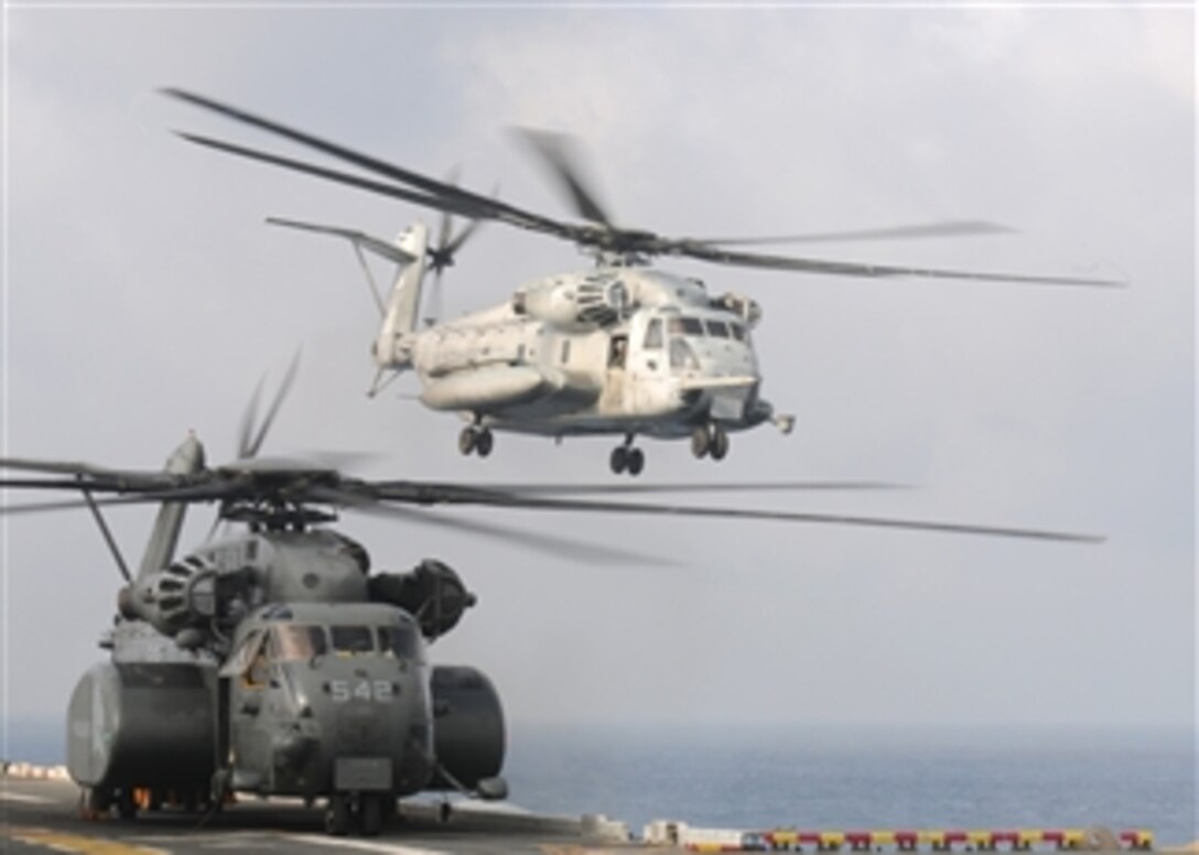 A U.S. Marine Corps CH-53E Sea Stallion helicopter assigned to Marine Medium Helicopter Squadron 262 takes off from the forward-deployed amphibious assault ship USS Essex (LHD 2) in the Sea of Japan on Aug. 12, 2009.  Marine Medium Helicopter Squadron 262 is disembarking the Essex to return to the U.S. as a part of their scheduled overseas rotation.  