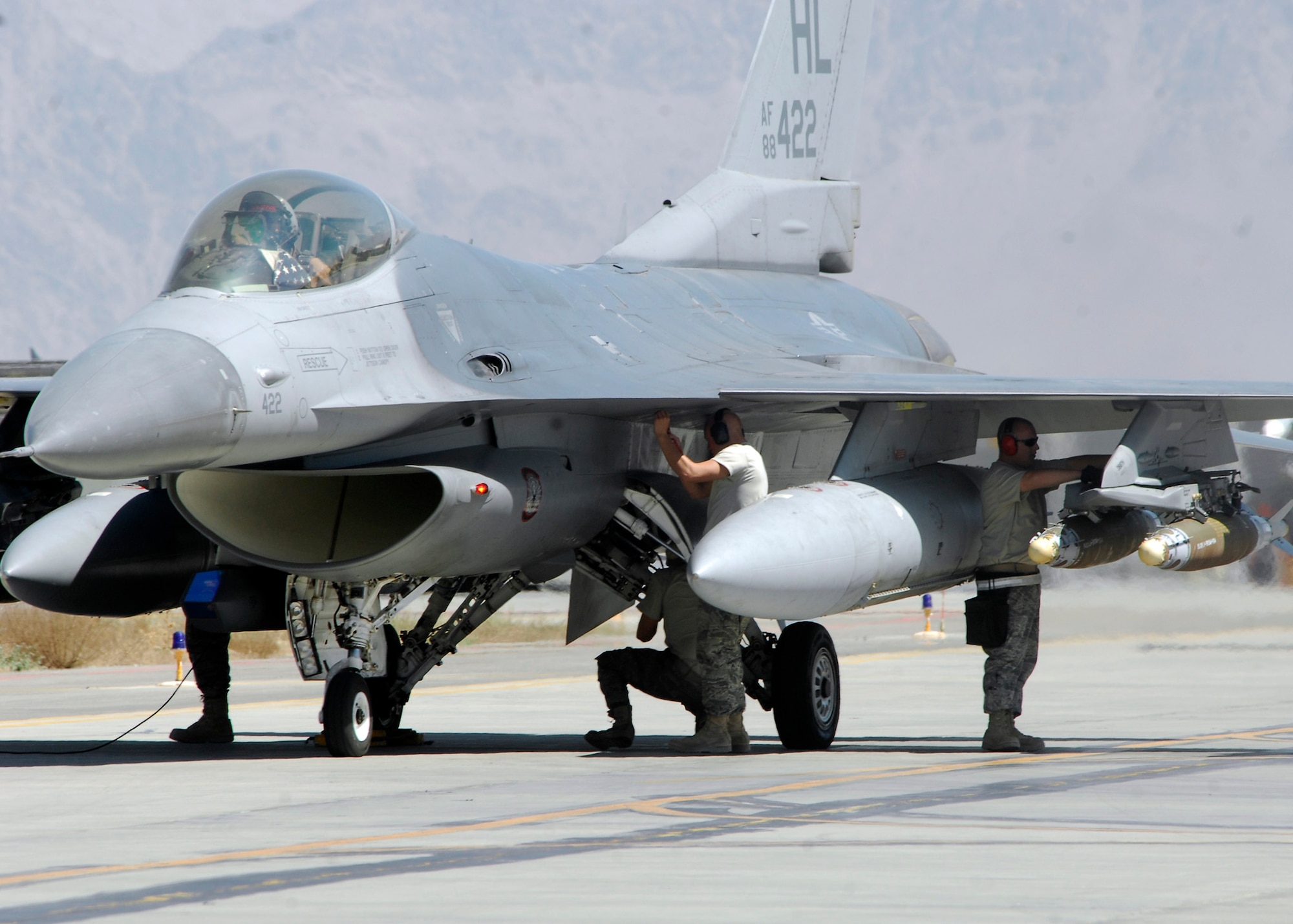Airmen perform a final safety inspection before an F-16 Fighting Falcon takes off from Bagram Airfield, Afghanistan for a mission Aug. 20. The F-16s and the Airmen are deployed from Hill Air Force Base, Utah, and are assigned to the 421st Expeditionary Fighter Squadron. (U.S. Air Force photo/Felicia Juenke)