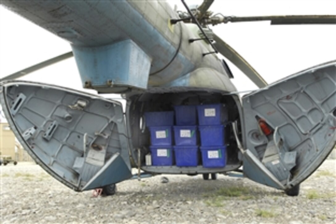 An Afghan National Army Air Corps Mi-17 is loaded to capacity in Shranana, Afghanistan, Aug. 16, 2009, with election ballots for its next delivery. During a two-day period, Afghan pilots and U.S. Air Force mentors from the 438th Air Expeditionary Advisor Group delivered ballots, polling kits, tables and chairs to remote Afghan locations to support the elections.