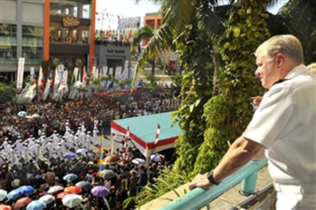 U.S. Navy Adm. Gary Roughead, chief of Naval Operations, right, watches crew members of the guided-missile destroyer USS McCampbell and other sailors from navies around the world march in a parade during the International Maritime Seminar in Manado, Indonesia, Aug. 18, 2009. Along with participating in the Indonesia International Fleet Review, Roughead is on an official counterpart visit to strengthen global maritime partnerships.