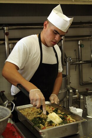 Lance Cpl. Jose Flores prepares an Italian pasta for the Chef of the Quarter Board at the Southside Mess Hall here August 20. Flores took home first place, allowing him the chance to compete for Chef of the Quarter Marine Corps Bases Japan in Okinawa.