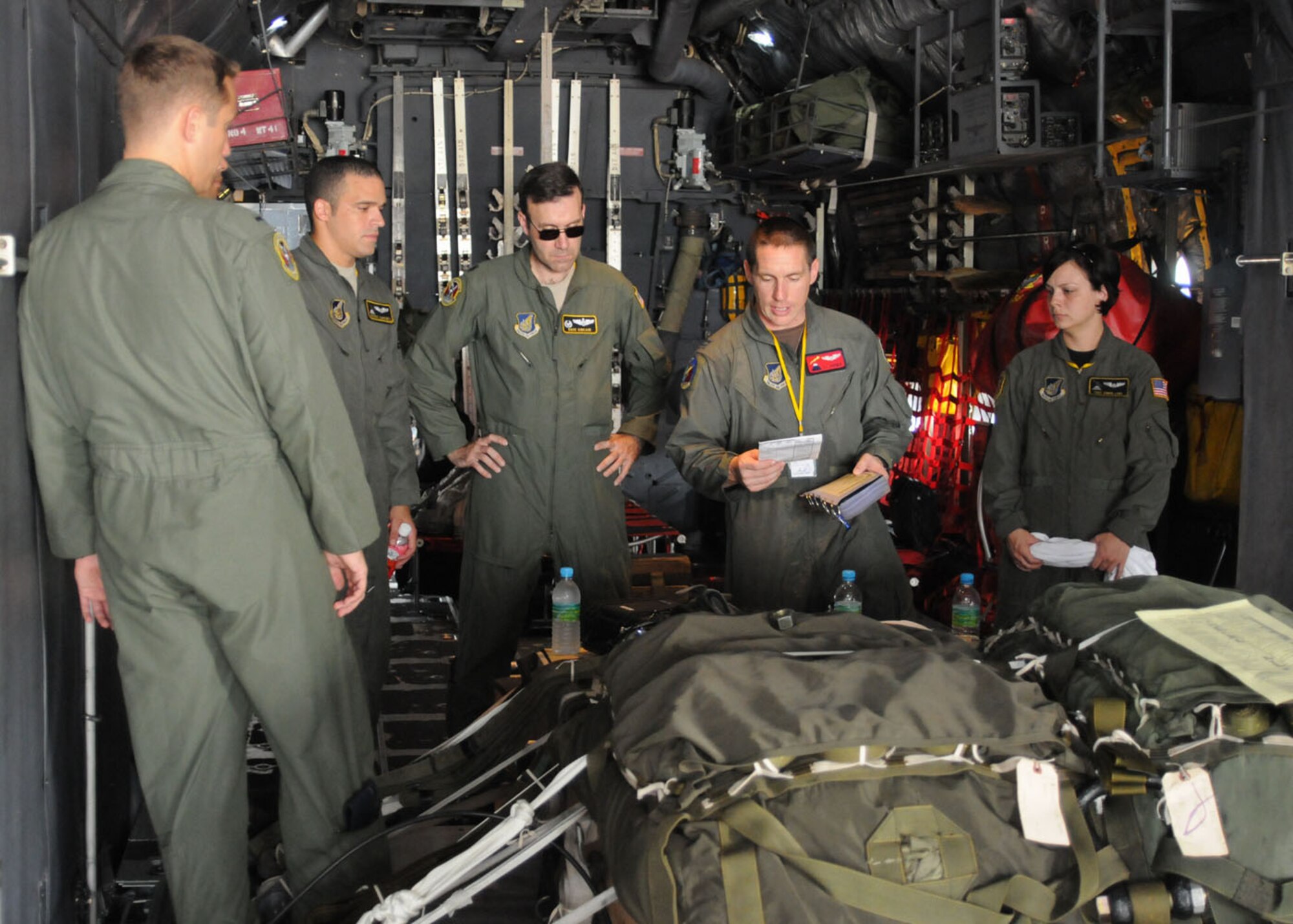 SUBANG ROYAL MALAYSIAN AIR FORCE BASE, Malaysia -- Aircrew members from the 36th Airlift Squadron at Yokota Air Base, Japan, gather for an aircrew briefing before takoff Aug. 19 during the 2009 Pacific Airlift Rally here. The PAR is a biennial exercise involving Pacific Rim nations which enhances military airlift interoperability with a focus in humanitarian assistance and disaster relief operations. The exercise consists of a tabletop exercise and a field-training exercise involving three C-130 aircraft from the 374th Airlift Wing at Yokota Air Base, Japan, and one C-130 each from the Royal Malaysian Air Force, Royal Australian Air Force, Republic of Singapore Air Force and Royal New Zealand Air Force. (U.S. Air Force photo/Staff Sgt. Veronica Pierce)