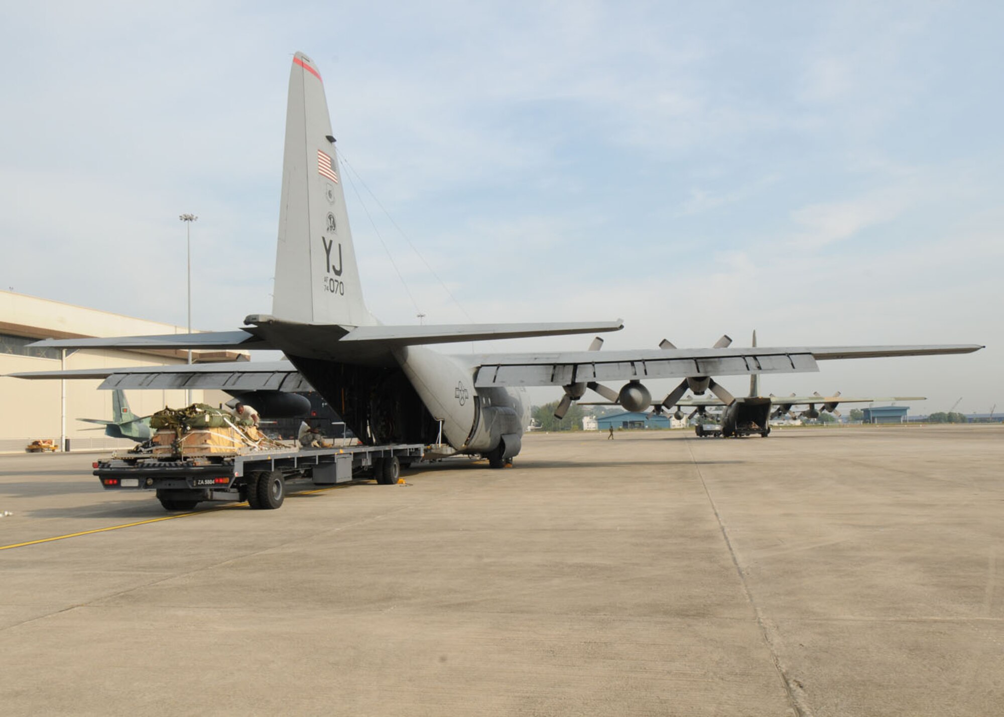 SUBANG ROYAL MALAYSIAN AIR FORCE BASE, Malaysia -- Airmen from the 374th Airlift Wing at Yokota Air Base, Japan, load cargo onto a 36th Airlift Squadron C-130 Hercules before a heavy-equipment airdrop Aug. 19 during the 2009 Pacific Airlift Rally here. The PAR is a biennial exercise involving Pacific Rim nations which enhances military airlift interoperability with a focus in humanitarian assistance and disaster relief operations. The exercise consists of a tabletop exercise and a field-training exercise involving three C-130 aircraft from the 374th Airlift Wing at Yokota Air Base, Japan, and one C-130 each from the Royal Malaysian Air Force, Royal Australian Air Force, Republic of Singapore Air Force and Royal New Zealand Air Force. (U.S. Air Force photo/Staff Sgt. Veronica Pierce)