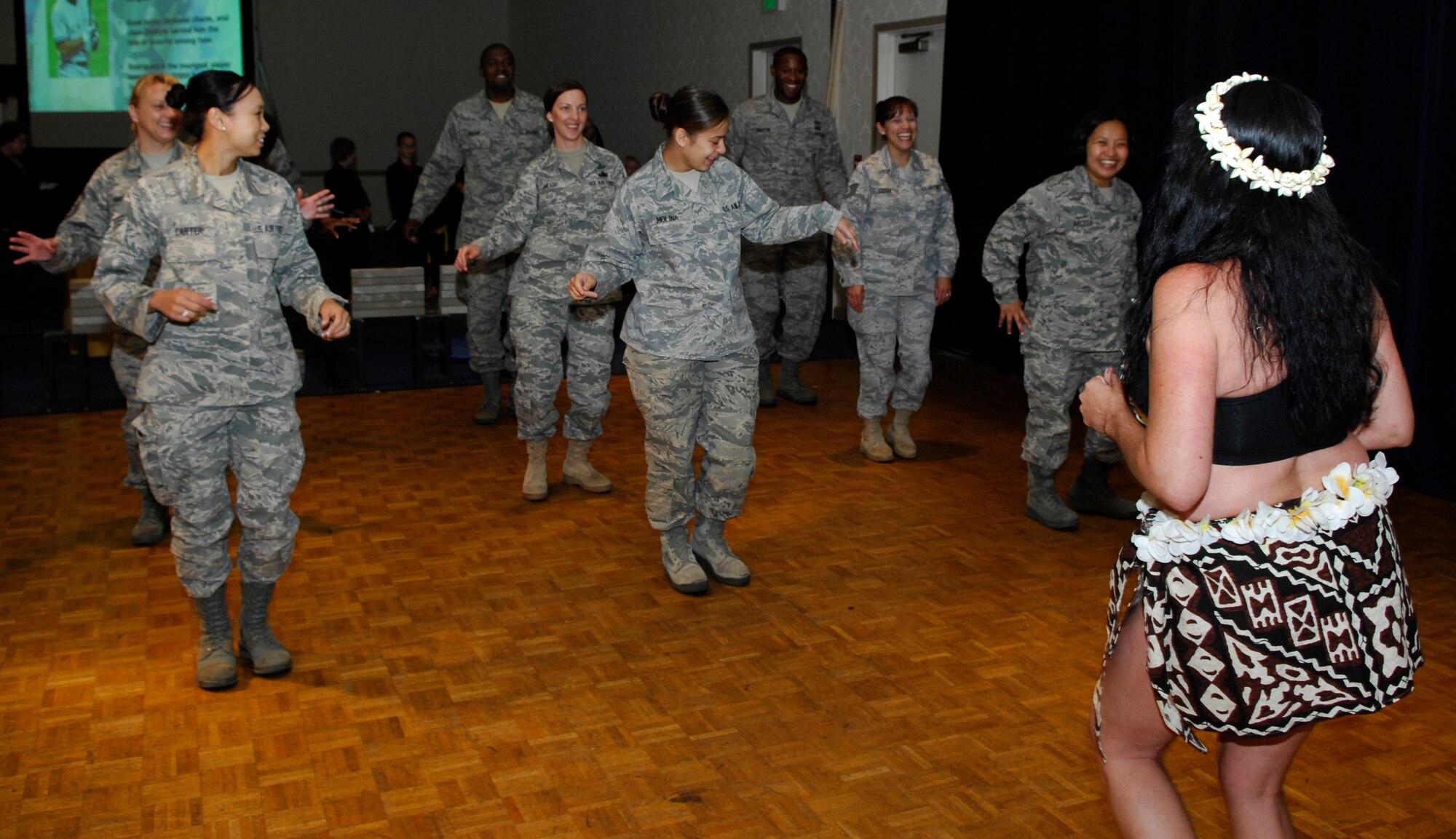 VANDENBERG AIR FORCE BASE, Calif. -- Team V members were afforded the opportunity to learn a native hula dance during Cultural Heritage Day here Aug. 20. The event, sponsored by the Vandenberg Equal Opportunity Office, provided the chance to experience performances and taste foods from many different cultures.   (U.S. Air Force photo/Airman 1st Class Heather R. Shaw)