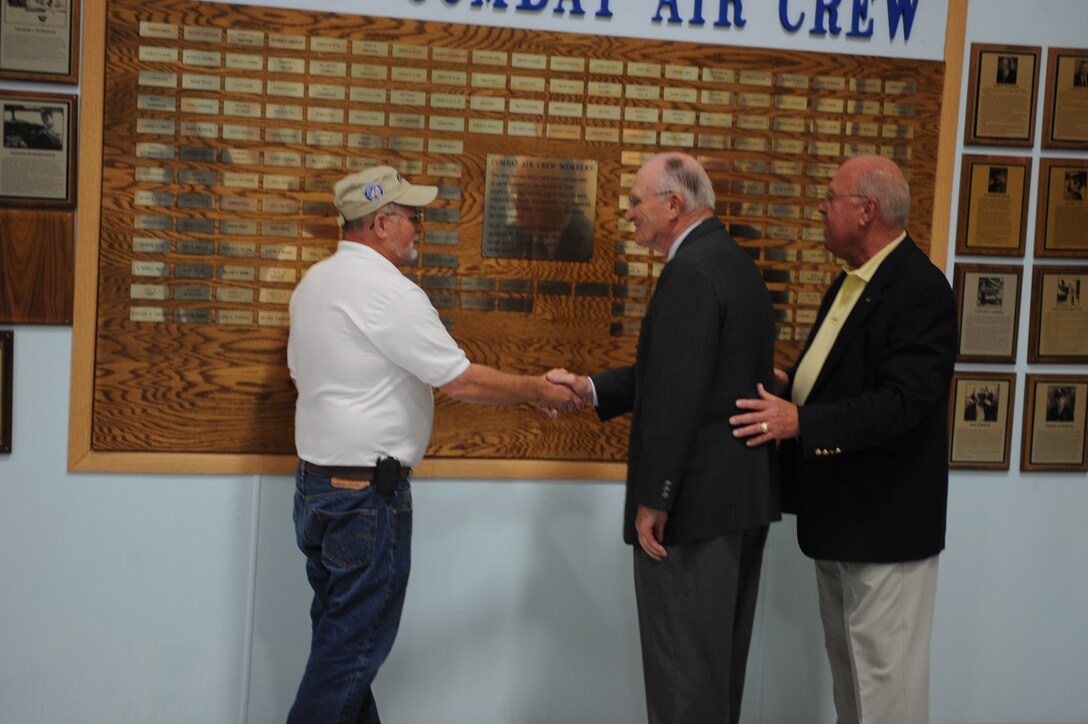 (Middle)Retired Lt. Harold Thune of the U.S. Navy thanks the induction committee during the South Dakota Aviation Hall of Fame ceremony held at the South Dakota Air and Space Museum, August 20.  Lieutenant Thune flew more than 50 combat missions from the aircraft carrier U.S.S. Intrepid in the Pacific Theater during World War ll. Lieutenant Thune shot down four Japanese aircraft in one mission and was awarded the Distinguished Flying Cross on Dec. 15, 1944. (U.S. Air Force photo/Airman 1st Class Adam Grant)