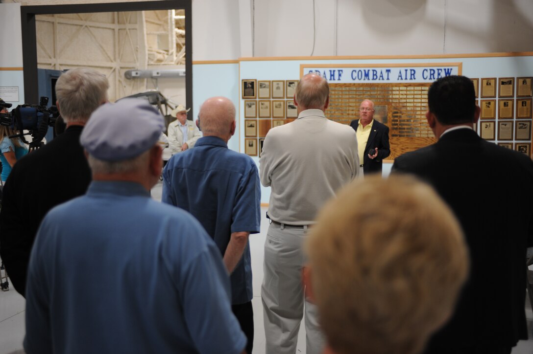 Mr. Ken Schroeder narrates during the South Dakota Aviation Hall of Fame ceremony held at the South Dakota Air and Space Museum, August 20. The ceremony was held to honor state residents who flew in past combat missions. (U.S. Air Force photo/Airman 1st Class Adam Grant)