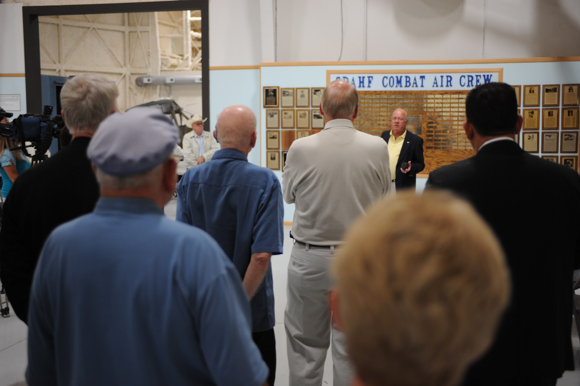 Mr. Ken Schroeder narrates during the South Dakota Aviation Hall of Fame ceremony held at the South Dakota Air and Space Museum, August 20. The ceremony was held to honor state residents who flew in past combat missions. (U.S. Air Force photo/Airman 1st Class Adam Grant)
