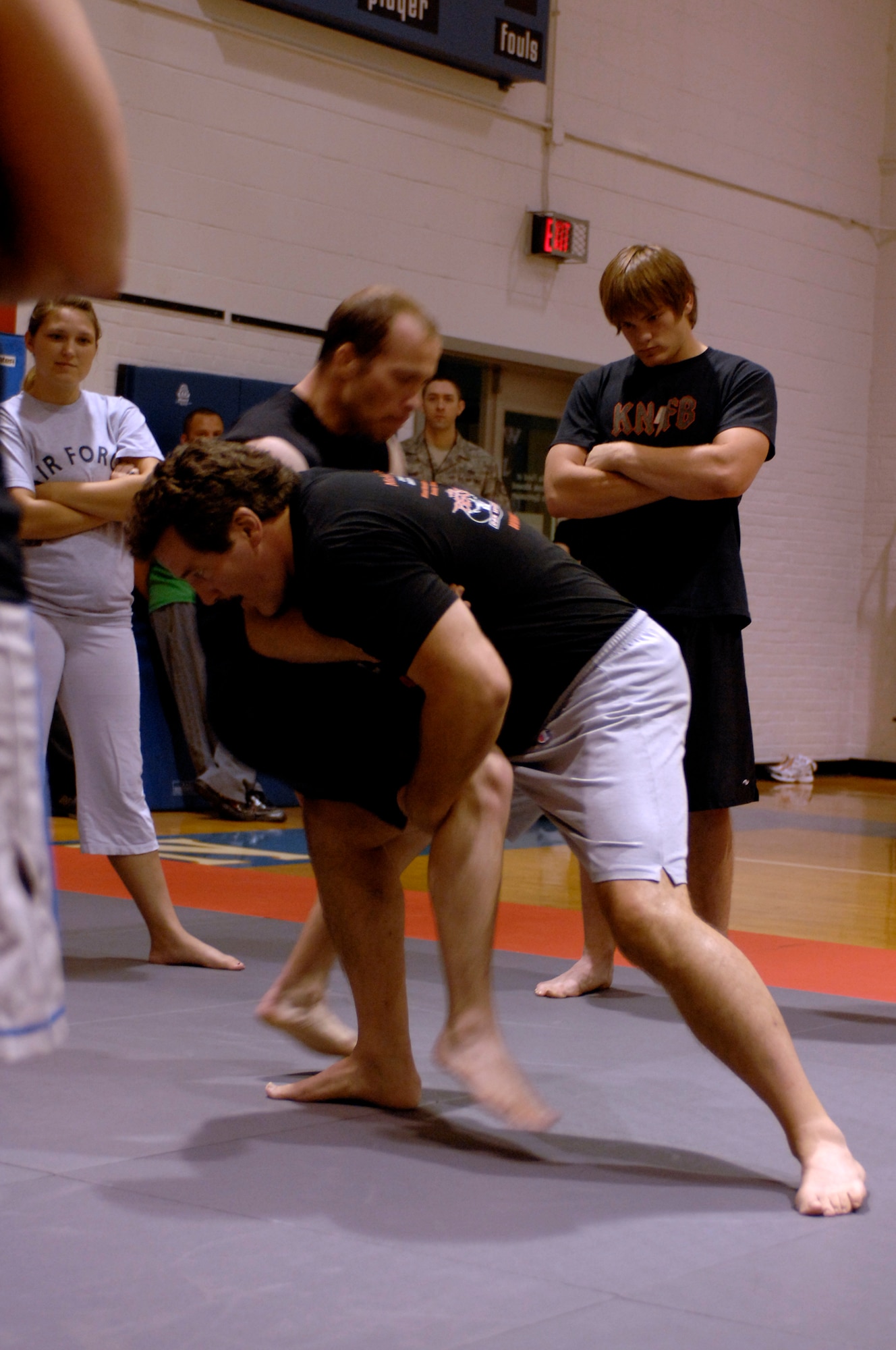 WHITEMAN AIR FORCE BASE, Mo. - Dan Severn, American mixed martial artist and professional wrestler, performs a double-leg takedown Aug. 20 to show members of Team Whiteman the proper way to execute the move. Mr. Severn performed three different training sessions for Airmen and their families stationed at Whiteman. (U.S. Air Force photo/Staff Sgt. Jason Barebo)