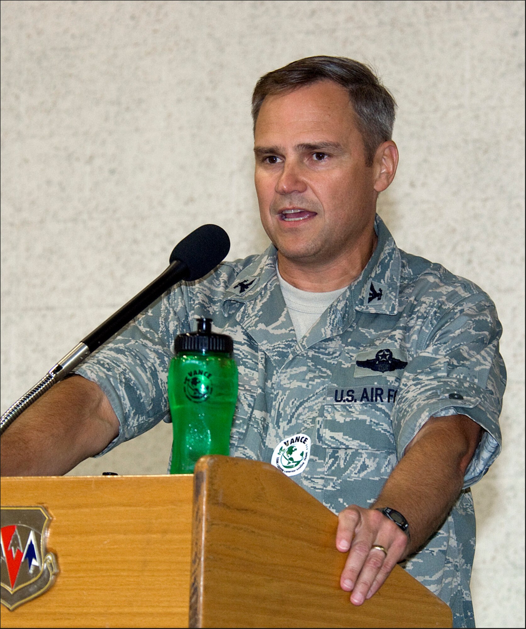 Col. Chris Nowland, 71st Flying Training Wing commander, congratulates Team Vance on its hard work during the Air Education and Training Command Energy Management Incentive Award program, during a celebration Aug. 20 at the Vance AFB fitness center. The Energy Conservation celebration featured music, free food and conservation-themed games and giveaways. Vance will soon learn where it placed in the AETC energy conservation contest that ran from July 2008 until June 2009. First place will earn Vance $1.5 million, second will earn $1 million and third will bring in $500,000. (U.S. Air Force photo/ Terry Wasson)