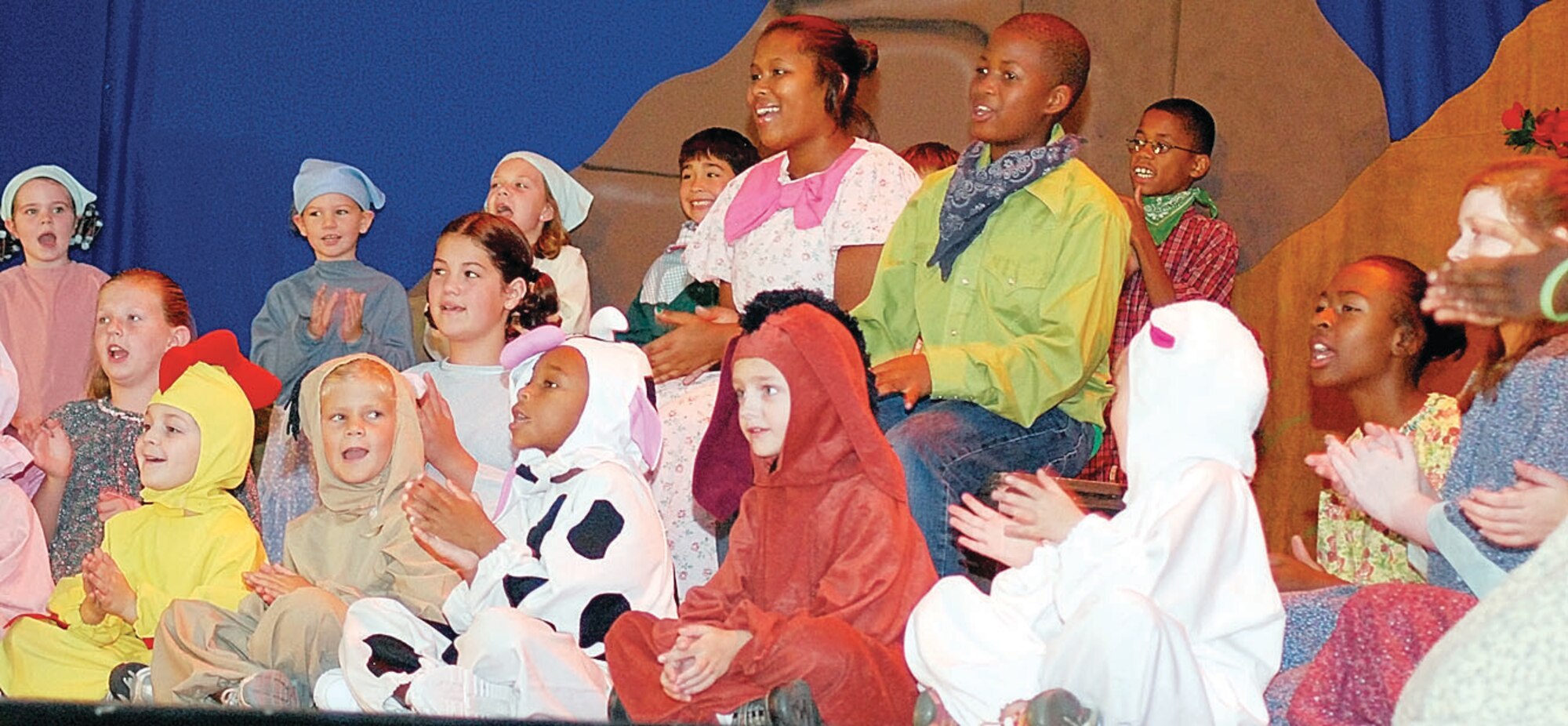 Children participate in the Missoula Children’s Theater production of “Beauty Lou and the Country Beast.”  The production tour is based out of Missoula, Mont., and travels worldwide giving children an opportunity to become involved with the performing arts. (U.S. Photo by Staff Sgt. Brian Margavich)