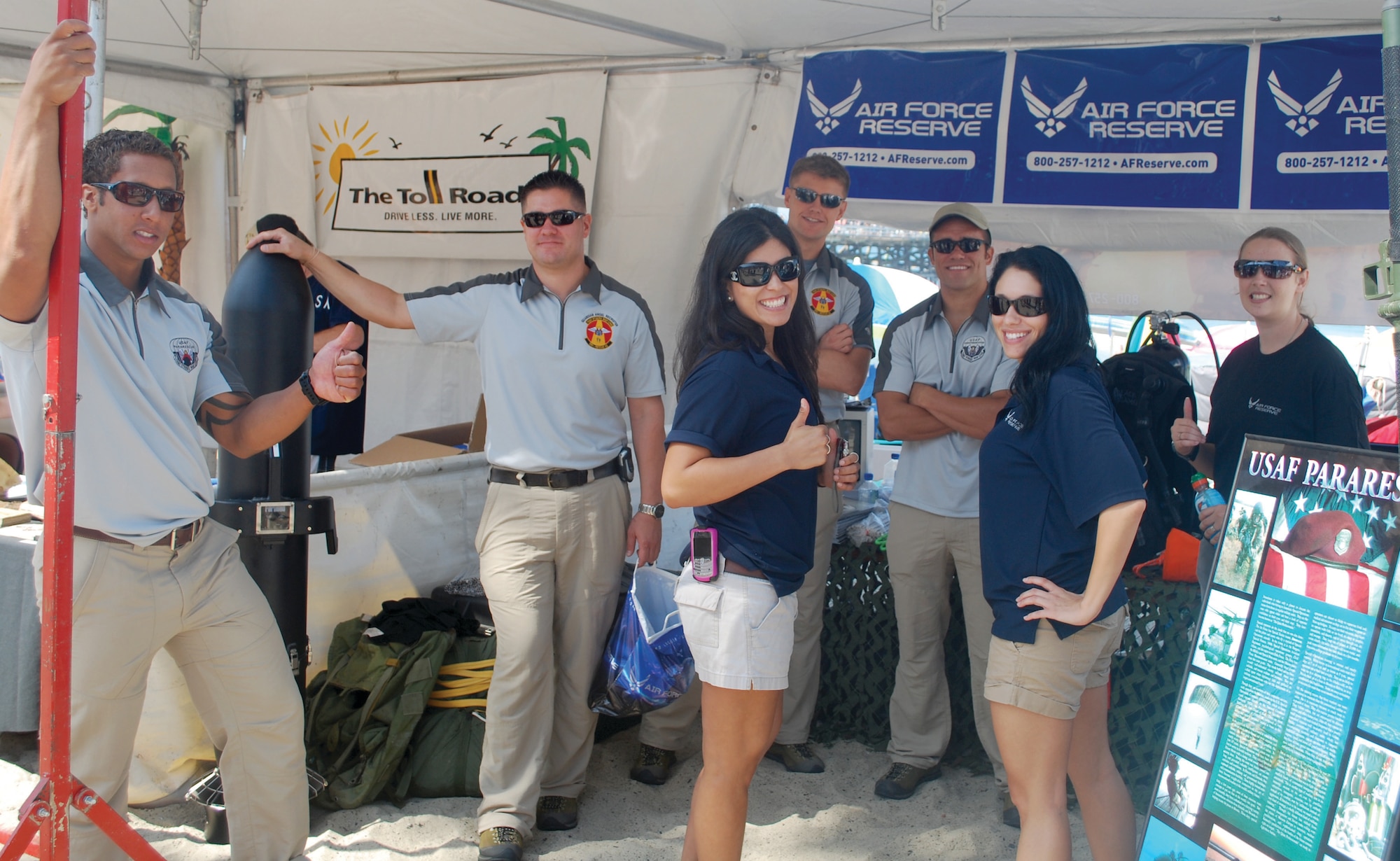 Reserve recruiters from the Western Recruiting Squadron based at March ARB work together to look for future pararescuemen at a San Clemente Ocean Festival booth, July 18. (U.S. Air Force courtesy photo)