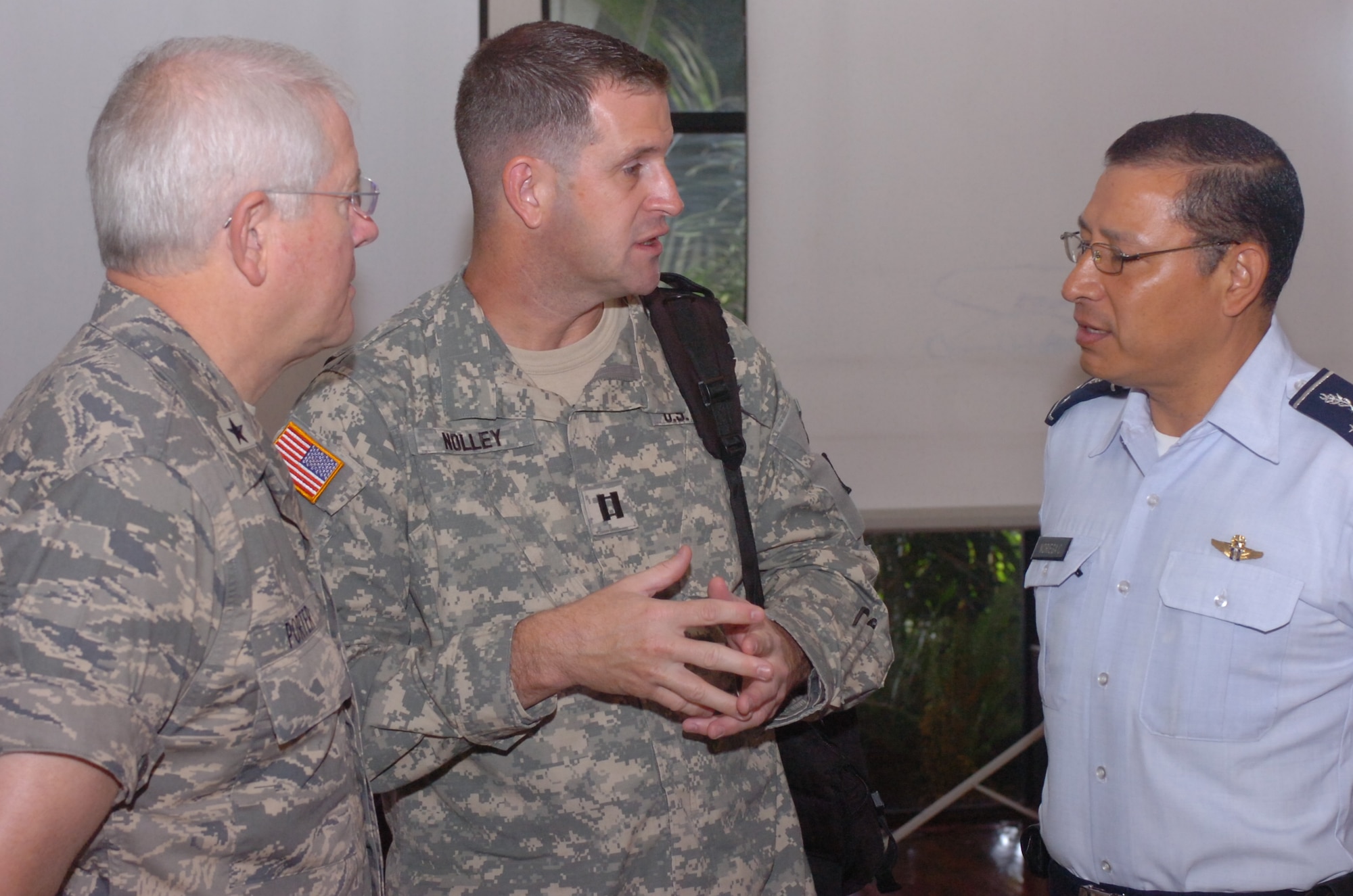 Air Force Leaders – Brig. Gen. Riley Porter (left), commander of the Arkansas Air National Guard speaks with Gen. Pedro Noriega (right), commander of the Guatemalan Air Force through an interpreter Capt. James Nolley following Noriega's presentation regarding the role and status of the Guatemalan Air Force in defense of the nation.  Porter, along with commanders and senior enlisted advisors of several units of the Arkansas Air National Guard were in Guatemala Aug. 5-8 for a Senior Leader Exchange as part of the State Partnership Program. (Air Force Photo by Maj. Keith Moore, Public Affairs Officer, Joint Force Headquarters, Arkansas Air National Guard.)