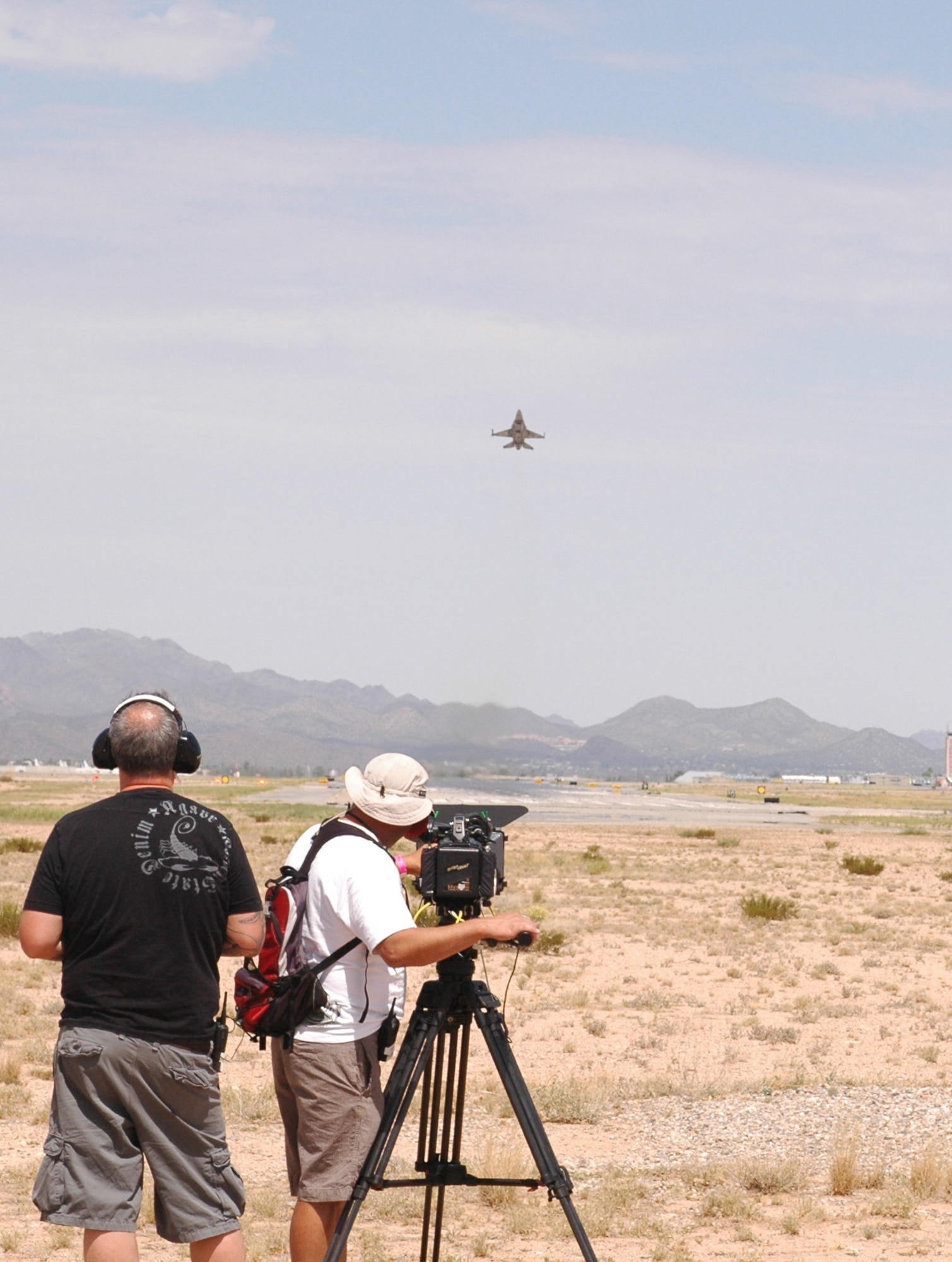 A United Arab Emirates F-16E Desert Falcon, block 60, takes off from Tucson International Airport while a documentary film crew captures the moment Aug. 12. Recognizing the historic significance of their first Red Flag, the U.A.E. government commissioned a production company to follow pilots and maintainers through the experience. (Air National Guard photo by Capt. Dan Dodson)