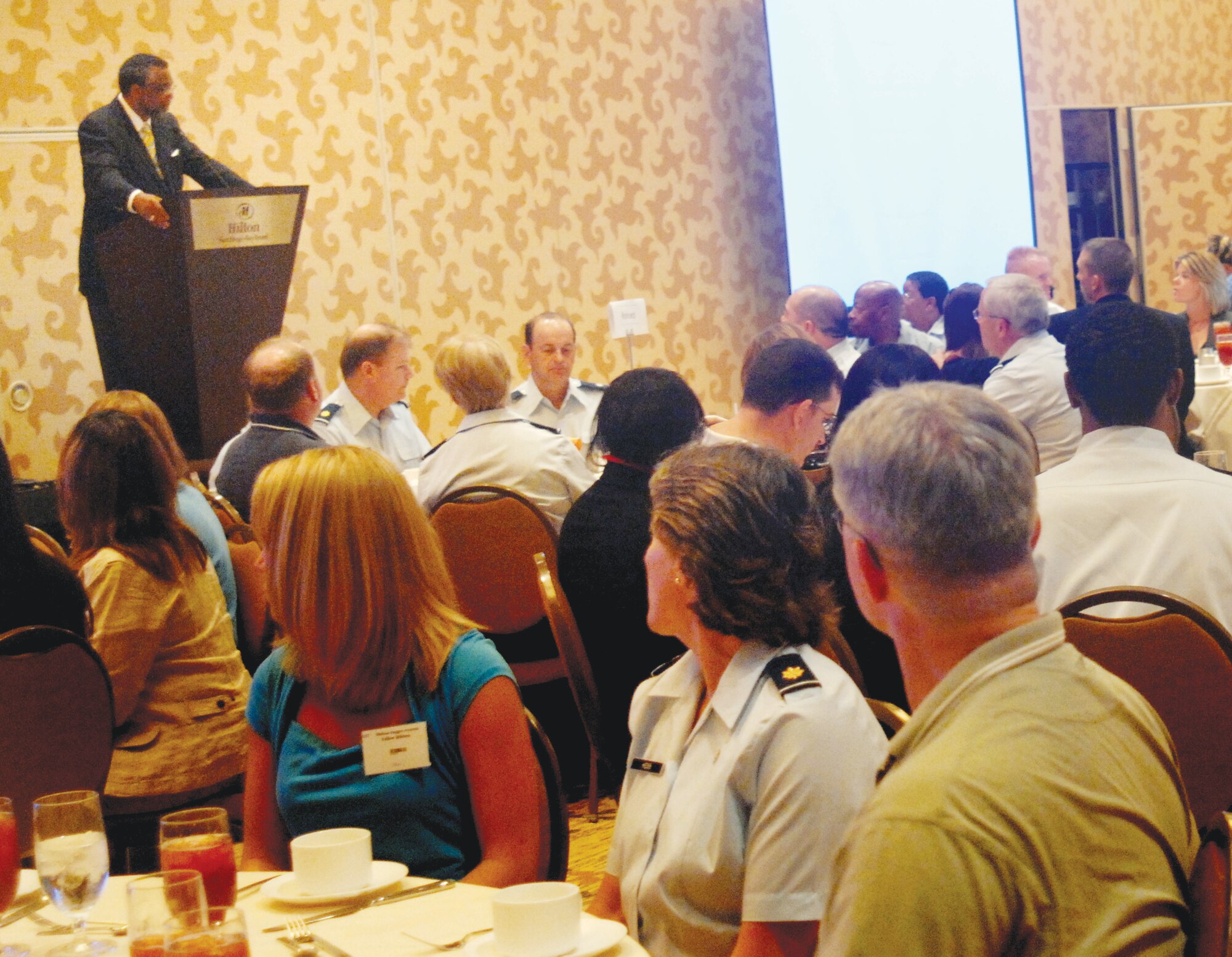 California State Senator Curren Price, 26th District, tells the 120 attendees at March’s first Yellow Ribbon Reintegration Program event how proud the state and the country are of their service and sacrifice. The two-day program, designed to help service members and their families cope with a variety of deployment issues, was held in San Diego. More than a dozen briefers covered various topics which included how to protect your identity, how to obtain a job in this tight economy, marriage and family resources, wills and powers of attorney, the Homeowner’s Assistance Program and the Servicemembers Civil Relief Act. (U.S. Air Force photo by TSgt. Michele Desrochers)