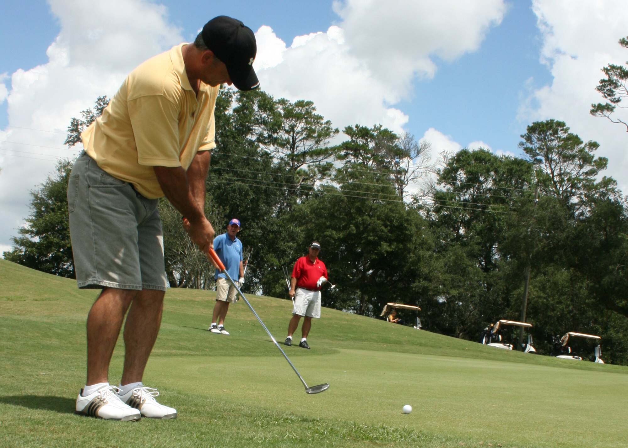 Randy Anderson, AFRL intramural golf team member, putts during the championship game Aug. 19 at the Eglin Golf Course.  The AFRL team beat the 919th Special Operations Wing team on the second hole of a sudden-death playoff. AFRL has won the championship four of the last five years. (Photo/2nd Lt. Andrew Caulk)