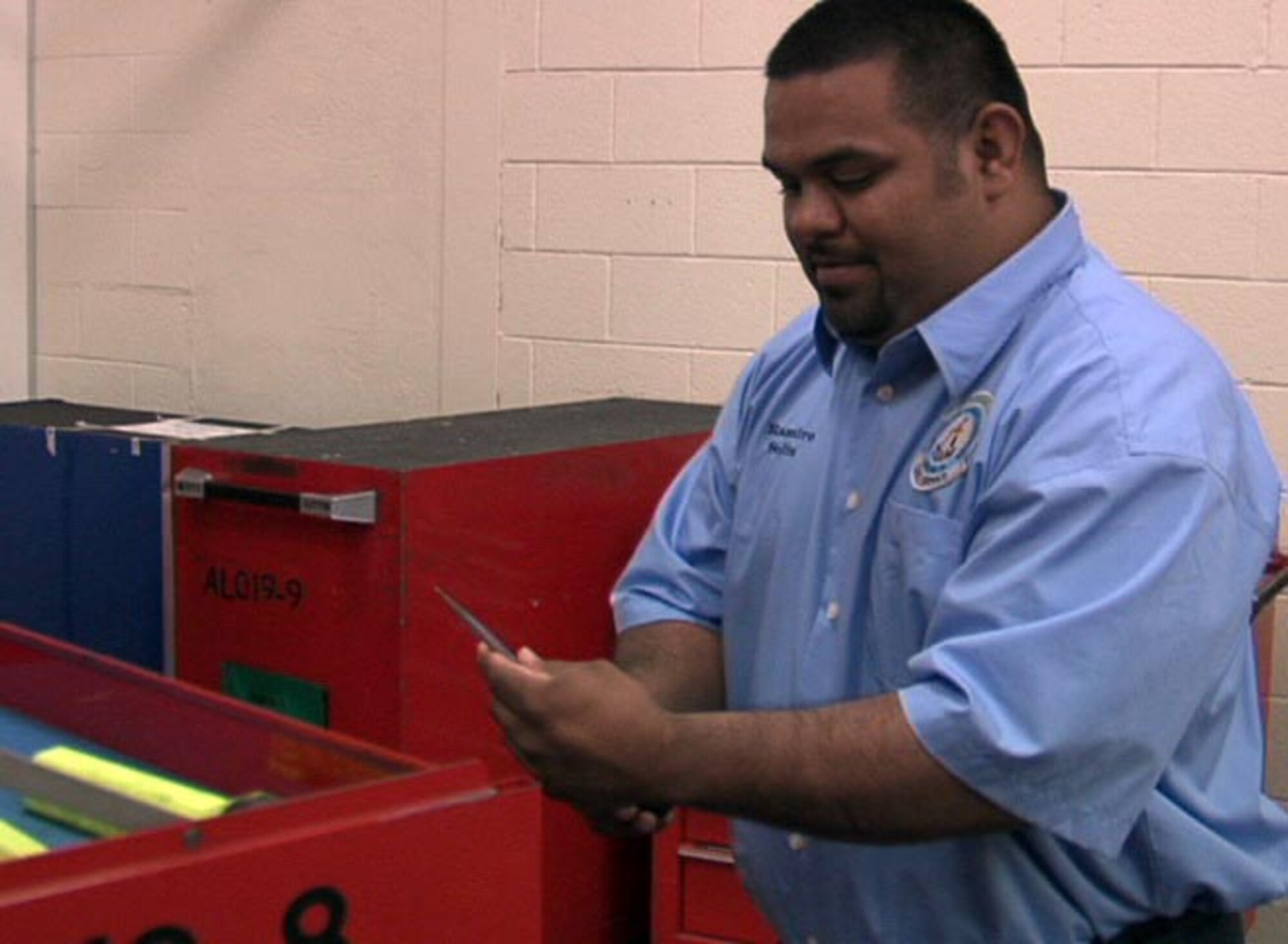 ALTUS AIR FORCE BASE, Okla. -- Ramiro Solis from the 97th Maintenance Directorate is taking an inventory of tools for aircraft maintenance.  Mr. Solis was recently appointed the highest ranking employee from the Grow-Your-Own Mechanic Program from the local Vo-Tech.  (U.S. Air Force photo/Kenny Scarle)