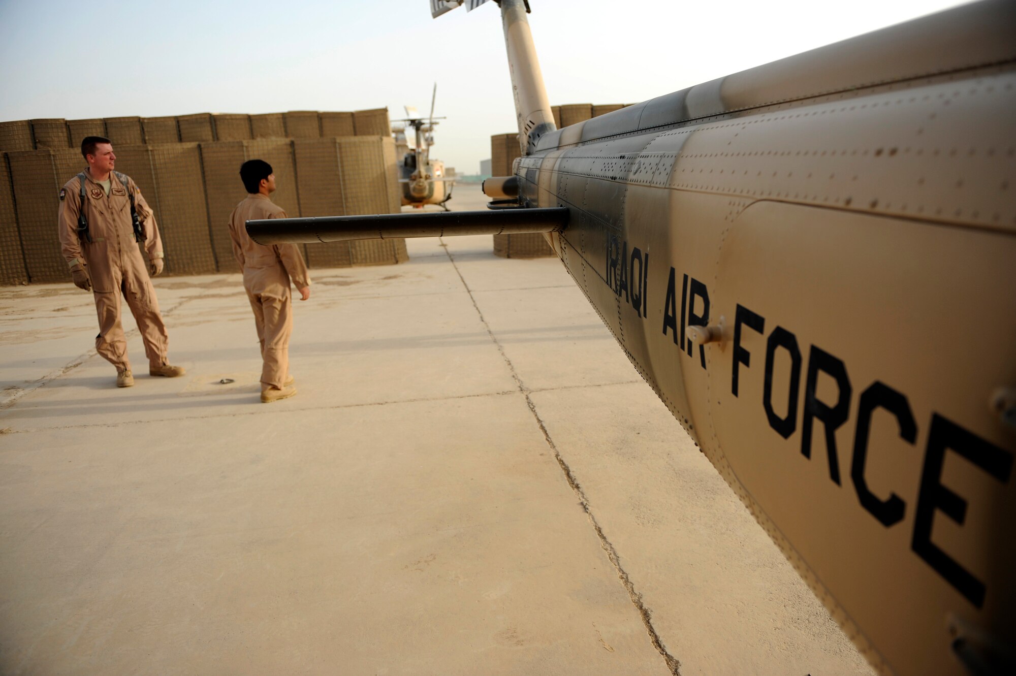 U.S. and Iraqi Air Force aircrew prepare an Iraqi UH-1H II Huey prior to a mission at Taji Air Base, Iraq, July 14, 2009.  (U.S. Air Force photo by Staff Sgt. Michael B. Keller) (Released) 

