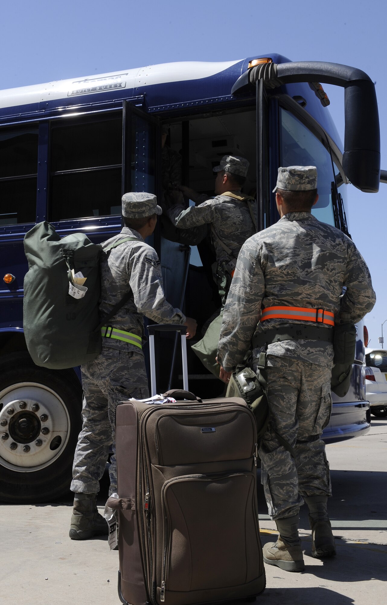 HOLLOMAN AIR FORCE BASE, N.M. -- Airmen load baggage into a bus during an exercise here Aug. 19. The exercise allowed Airmen to experience the processes necessary for deployment.(U.S. Air Force photo by Senior Airman Tiffany Trojca)