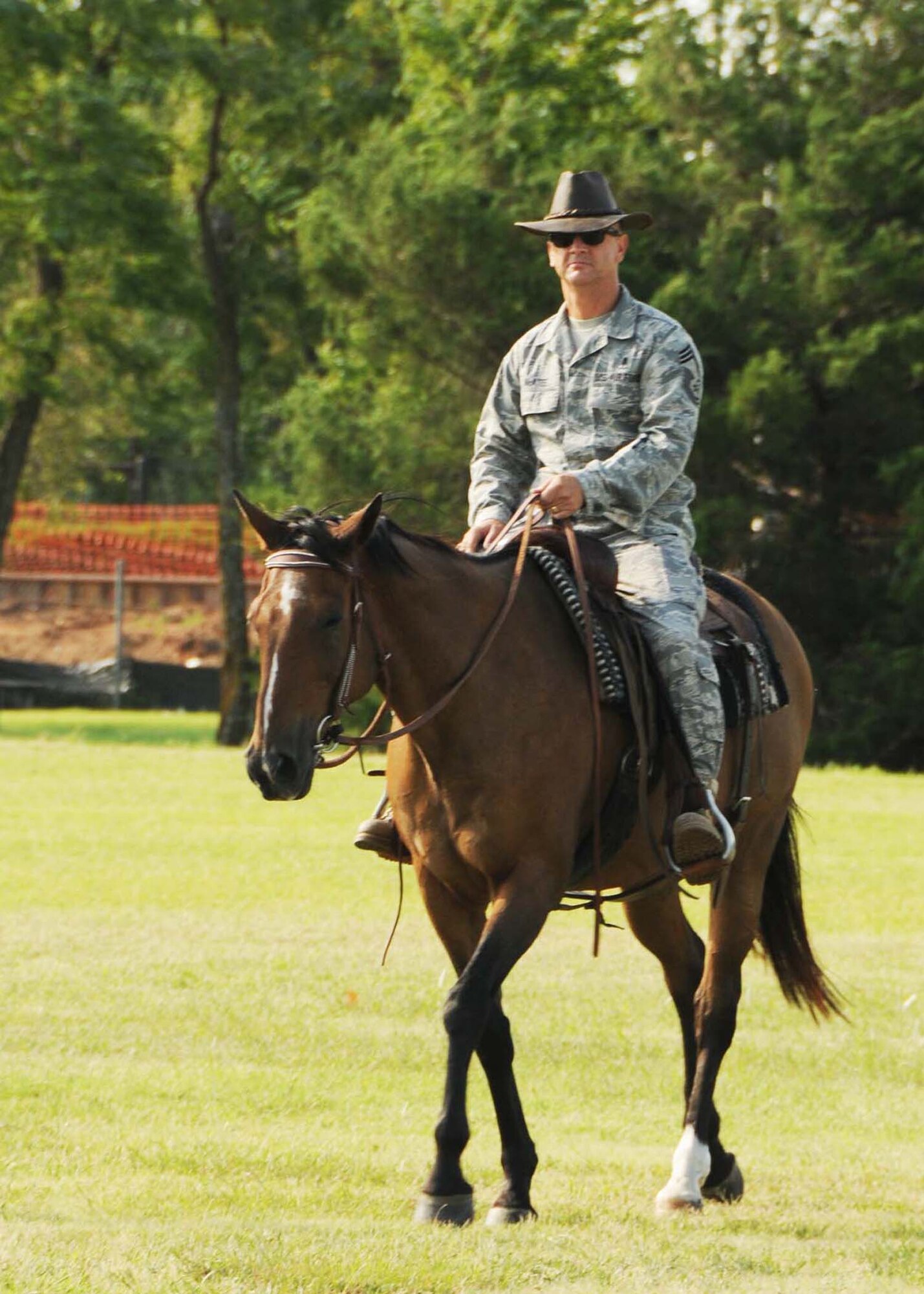 ALTUS AIR FORCE BASE, Okla.-Chief Master Sgt. Ronald McAtee, 97th Medical Group superintendent, rides solo during the Cattle drive at Altus Air Force Base Aug. 20. The cattle drive kicks off the Great Plains Stampede Rodeo every year. The rodeo is Aug 20 to 22. (U.S. Air Force Photo/Senior Airman Marianne E. Lane)