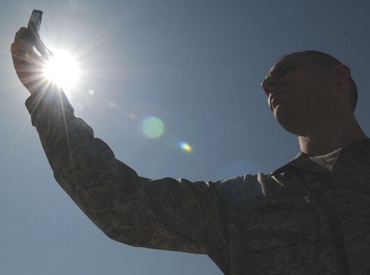 Senior Airman Raymond Mitchell, a 39th Operations Squadron weather technician, uses a handheld weather gauge capable of measuring basic weather information Thursday, Aug. 13, 2009 at Incirlik Air Base, Turkey. Airman Mitchell and other 39th OS weather technicians provide the base with daily weather information. (U.S. Air Force photo/Senior Airman Alex Martinez)