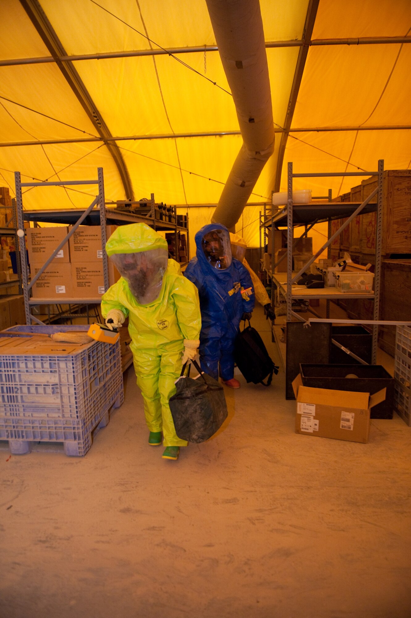 Front to back, Staff Sgt. Kevin Spranger, 379th Expeditionary Civil Engineer Squadron readiness and emergency management flight, Senior Airman John Matlock, 379th Expeditionary Medical Group Bioenvironmental Engineering Squadron, and Staff Sgt. Theodore Van De Sample, 379 ECES, conduct a survey for simulated hazardous materials during an exercise, Aug. 12, in Southwest Asia. The 379 ECES and 379 EMDG  trained together to better integrate their response to a bioenvironmental hazardous situation. Sergeant Spranger is deployed from Moody, Air Force Base, Ga.; Airman Matlock is deployed from Lackland AFB, Texas, and Sergeant Van De Sample is from Elmendorf AFB, Alaska. All are deployed in support of Operations Iraqi and Enduring Freedom. (U.S. Air Force Photo/ Staff Sgt. Robert Barney)