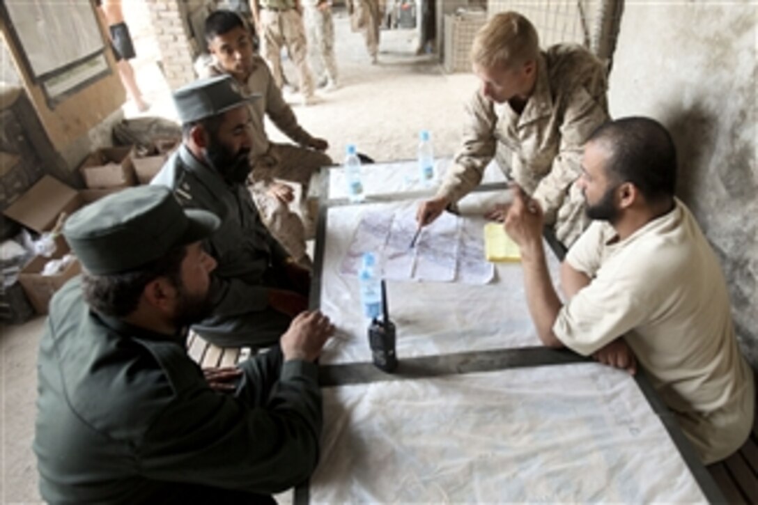 U.S. Marine Corps Lt. Col. William McCollough, commander of the 1st Battalion, 5th Marine Regiment, speaks with Afghan National Police officers at Patrol Base Jaker, in Nawa district, Helmand province, Afghanistan, on Aug. 16, 2009. The Afghan National Police officers came to coordinate the security arrangements for the upcoming presidential elections.  The Marines are deployed with Regimental Combat Team 3 to conduct counterinsurgency operations in partnership with the Afghan security forces in southern Afghanistan.  