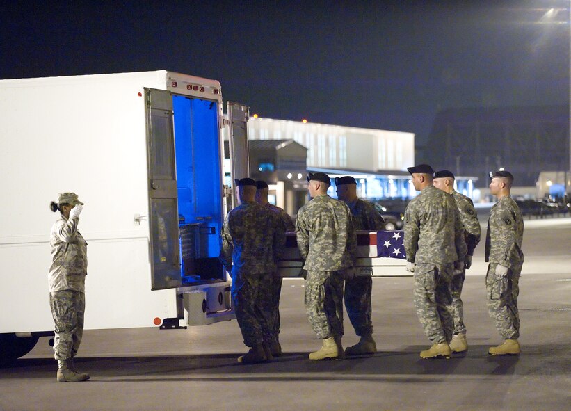 20 August 2009  USAF Photo by Jason Minto.  A Army carry team transfers the remains of Army Private First Class Morris L. Walker, of Chapel Hill, NC., at Dover Air Force Base, Del., August 20, 2009.  
 
