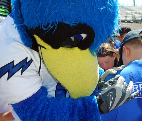 The Bird signs the back of Eric Hanson's T-Shirt during Kids' Day at Falcon Stadium Aug. 22, 2009. The Bird is the official mascot for Air Force Academy sports. Eric is the son of Maj. David Hanson, deputy director of staff for Air Force Space Command, and his wife, Mary. (U.S. Air Force photo/Staff Sgt. Don Branum)