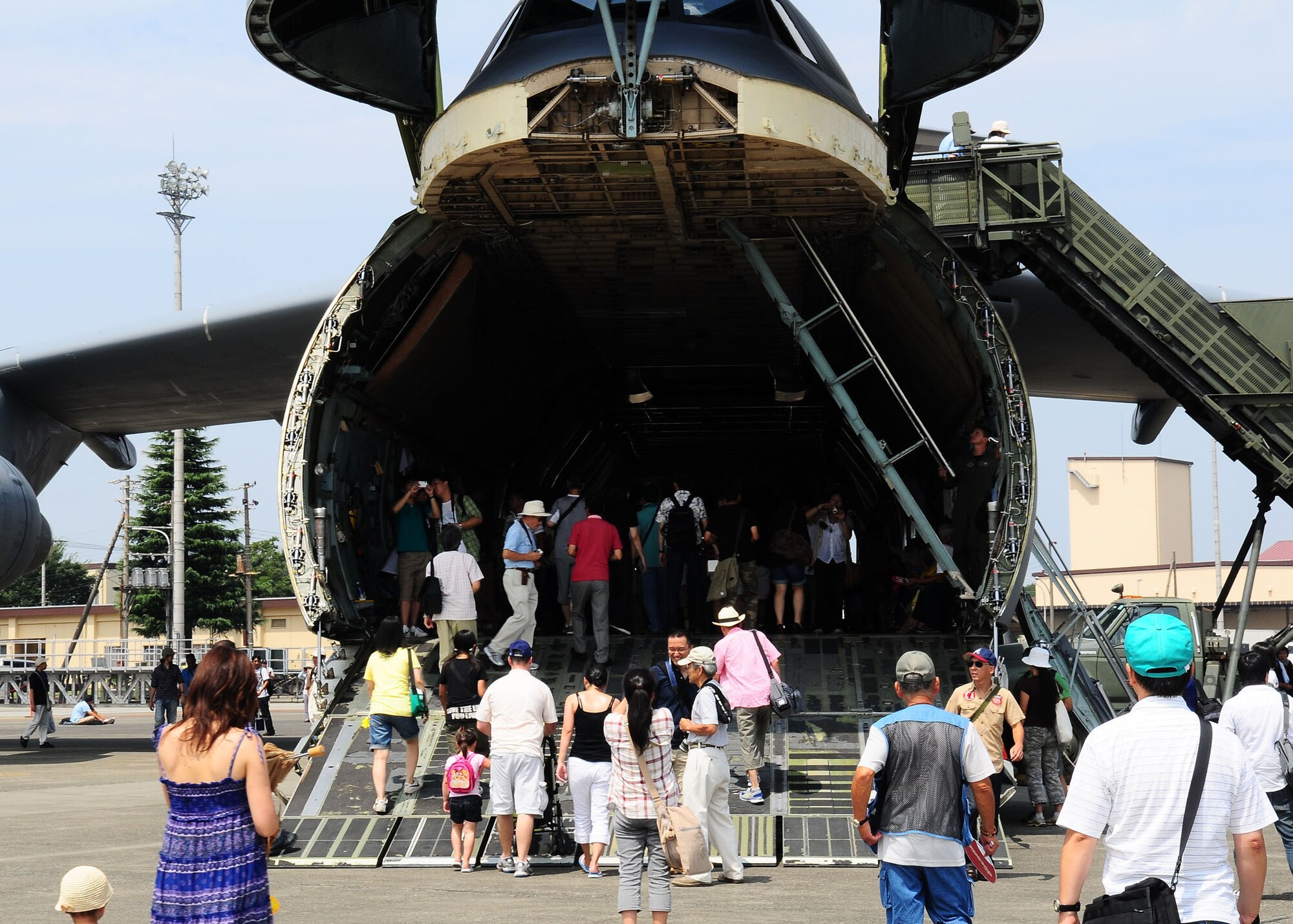 YOKOTA AIR BASE, Japan -- Festival goers walk through the cargo bay of a C-5 Galaxy Aug. 22 during the 2009 Yokota Air Base Japan Japanese-American Friendship Festival. More than 170,000 people attended the two-day event. In addition to static displays and live music, the festival offered a variety of American and Japanese food items. The festival is designed to bolster the bi-lateral relationship shared by the United States and Japan. (U.S. Air Force photo/Airman 1st Class Sean Martin)
