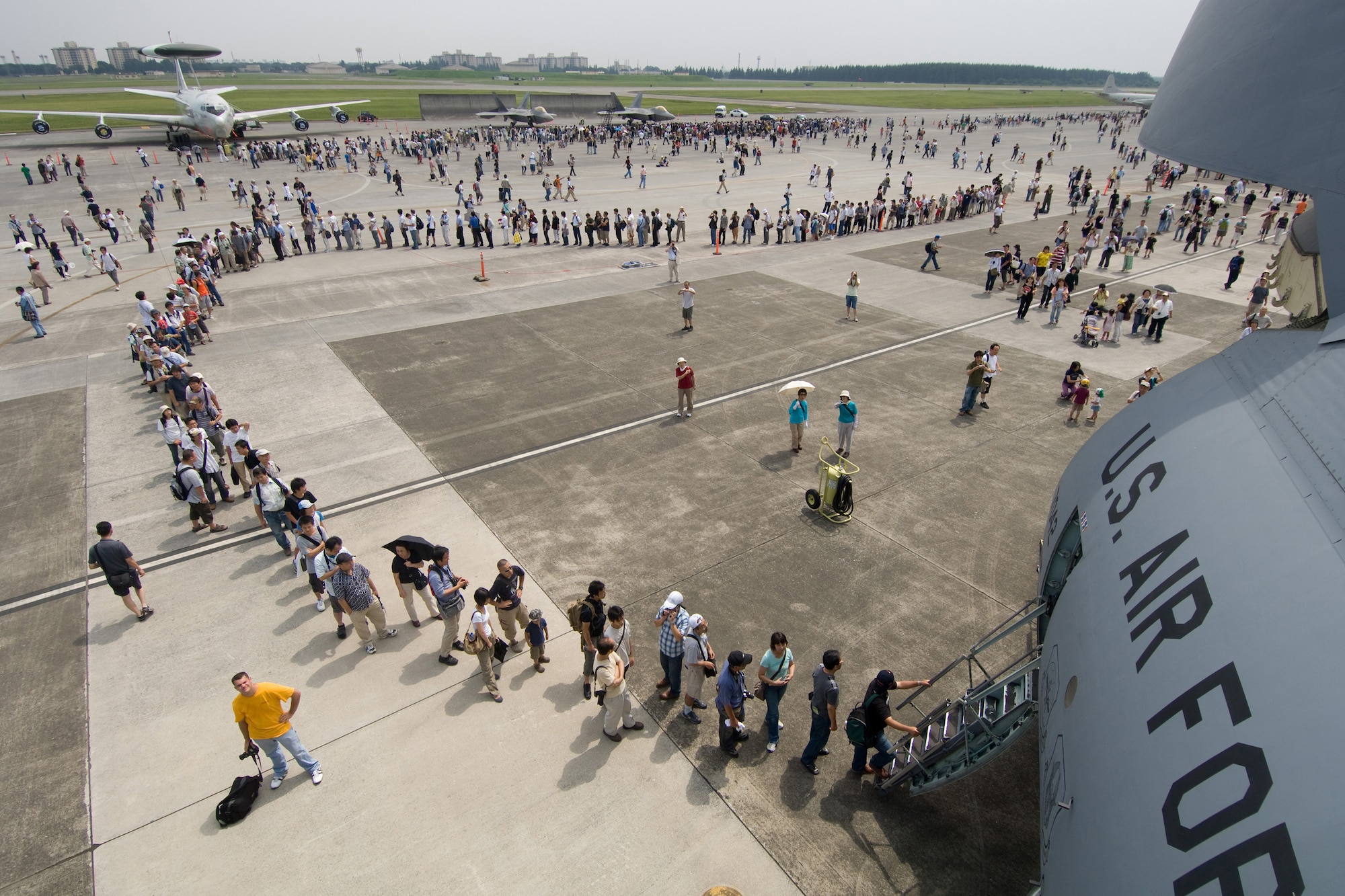 YOKOTA AIR BASE, Japan -- More than 80,000 people attended the first day of the two-day Yokota Air Base Japanese-American Friendship Festival Aug. 22. One highlight of the festival was a C-5 Galaxy static display. In addition to aircraft and live music, the festival offered a variety of American and Japanese food items. The festival is designed to bolster the bi-lateral relationship shared by the United States and Japan. ( U.S. Air Force photo/Osakabe Yasuo)