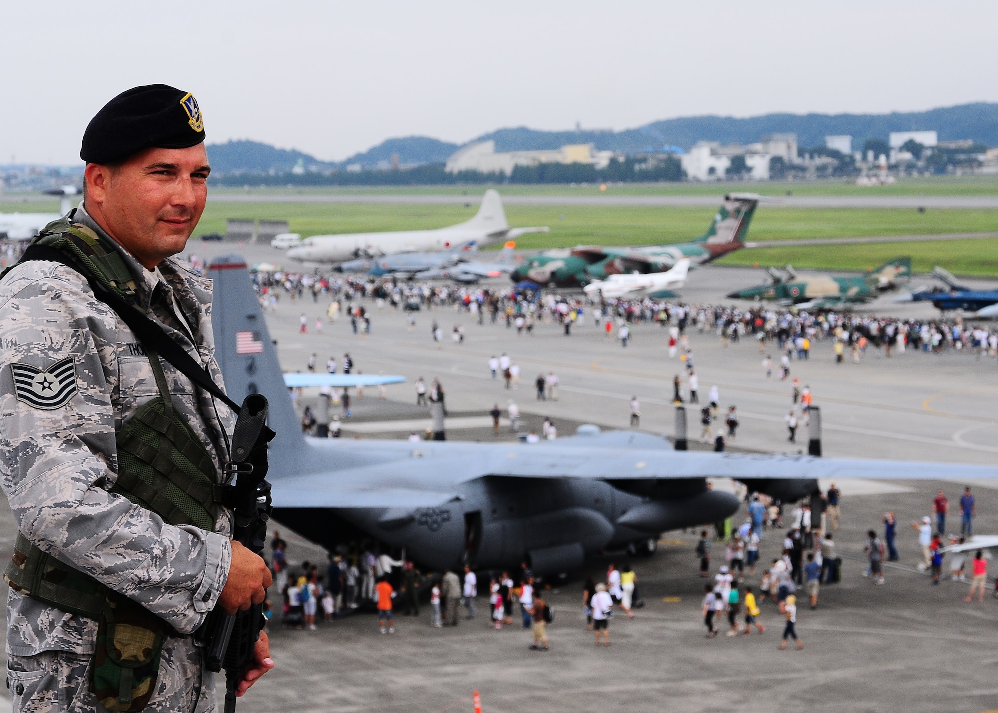 YOKOTA AIR BASE, Japan -- Tech. Sgt. Jeffery Thompson, 507th Security Forces Squadron, on temporary duty here, provides security overwatch Aug. 22 during the 2009 Yokota Air Base Japanese-American Friendship Festival. More than 80,000 people attended the first day of the two-day festival designed to bolster the bi-lateral relationship shared by the United States and Japan. (U.S. Air Force photo/Airman 1st Class Michael Dillon)  