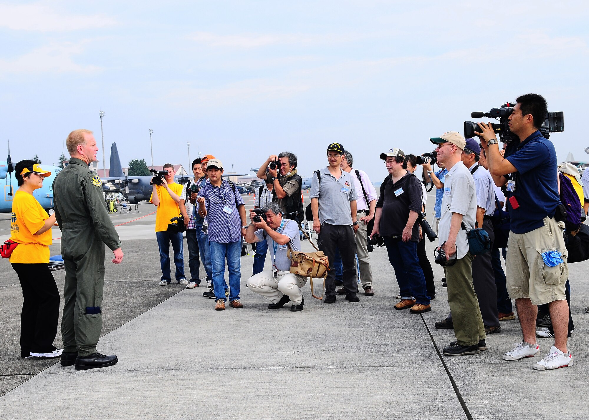YOKOTA AIR BASE, Japan -- Col. J. Marcus Hicks, 374th Airlift Wing commander, greets Japanese media at the start of the the 2009 Yokota Air Base Japanese-American Friendship Festival Aug. 22. More than 80,000 people attended the first day of the two-day festival designed to bolster the bi-lateral relationship shared by the United States and Japan. (U.S. Air Force photo/Airman 1st Class Michael Dillon)  
