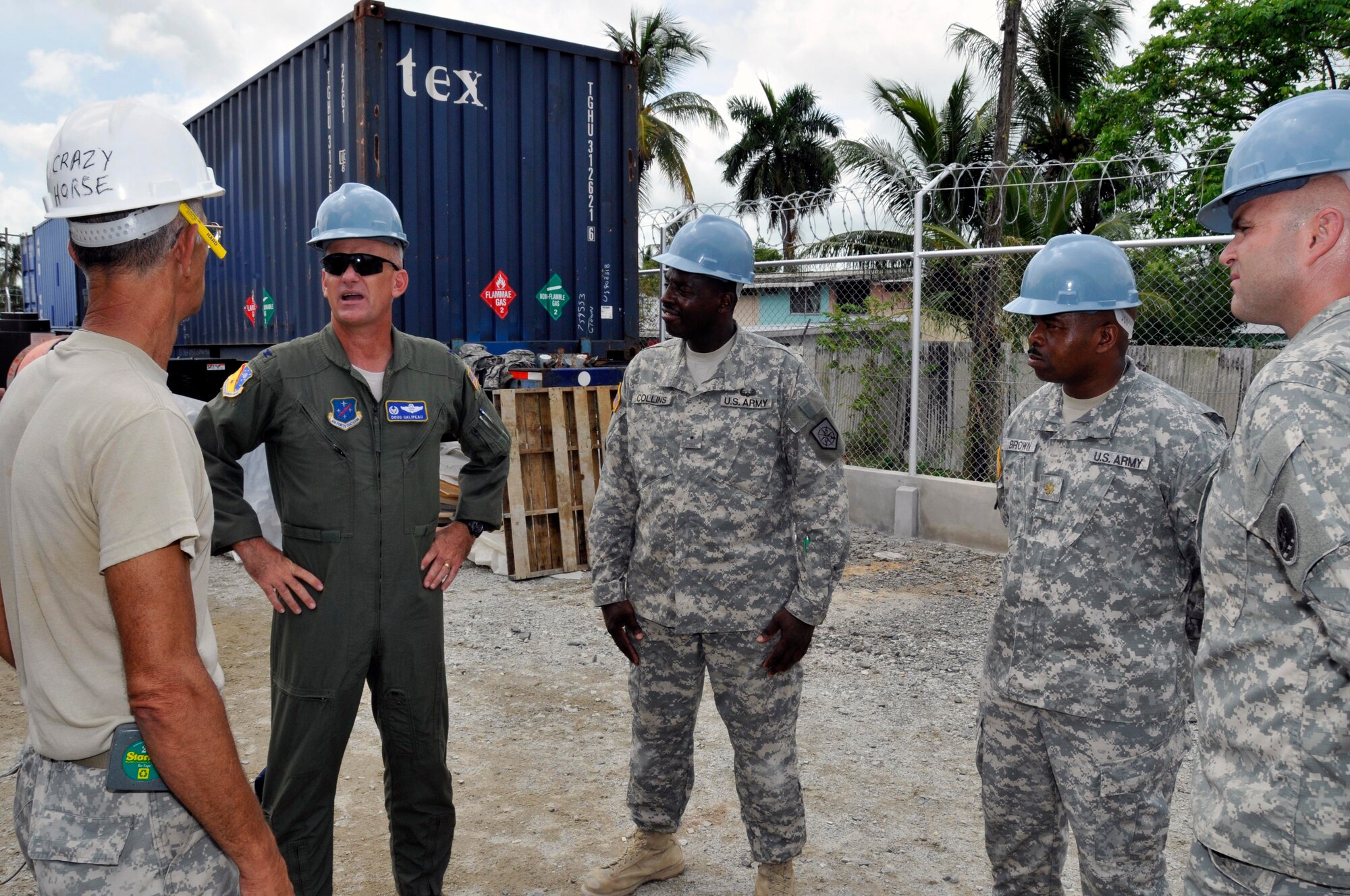 Col. Douglas Galipeau, 474th Air Expeditionary Group Commander speaks with Soldiers from the Georgia Army National Guard, Aug 20, 2009 at a new Medical Clinic in Georgetown, Guyana. Col. Galipeau visited two Medical Readiness and Training Exercises, one Dental Readiness and Training Exercise, an orphanage, and two construction projects all part of New Horizons Guyana. (U.S. Air Force photo by Airman 1st Class Perry Aston) (Released)