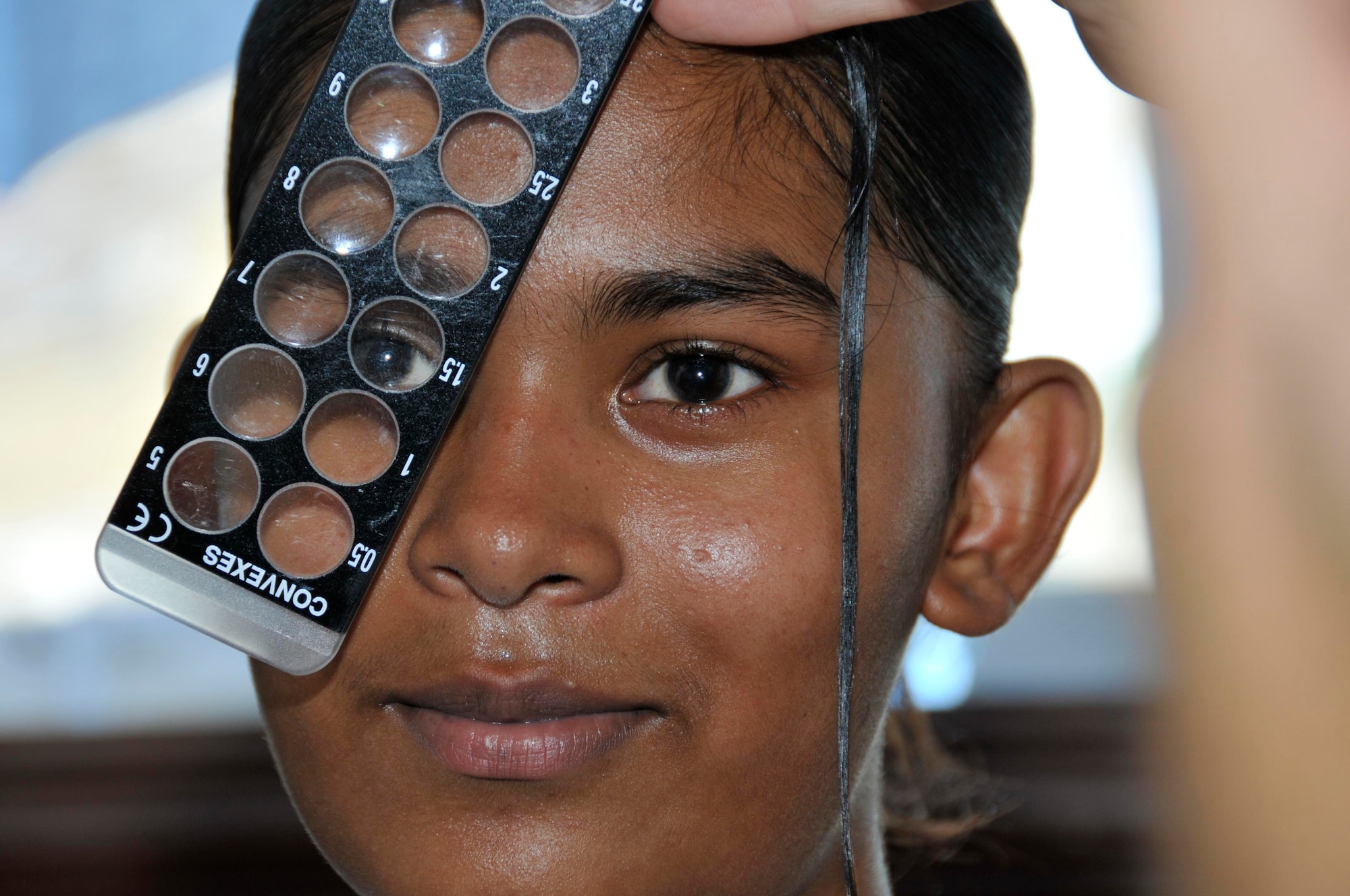 A Guyanese girl from Joshua's Place Orphanage recieves an eye check up Aug 18, 2009 at the Timehri School in Georgetown, Guayan. Airmen treated more than 60 children from the orphanage. (U.S. Air Force photo by Airman 1st Class Perry Aston) (Released)