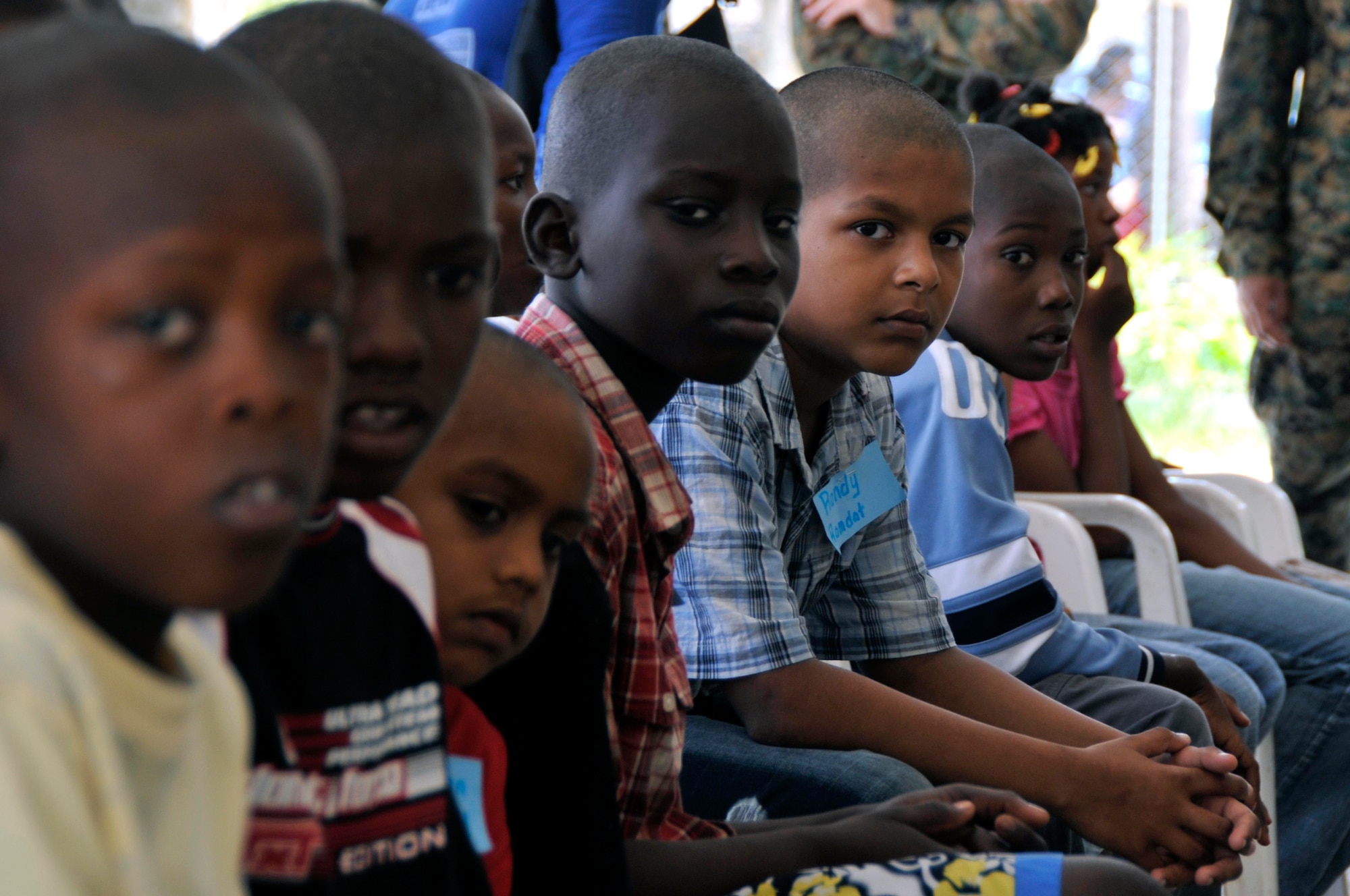 Children from Joshua's Place Orphanage wait for the check ups at the Timehri School Aug 18, 2009. Marines from the 4th Civil Affairs Group, Anacostia Naval Station, Washington DC, brought the children to the school for free medical check ups, dental and eye care. (U.S. Air Force photo by Airman 1st Class Perry Aston) (Released)