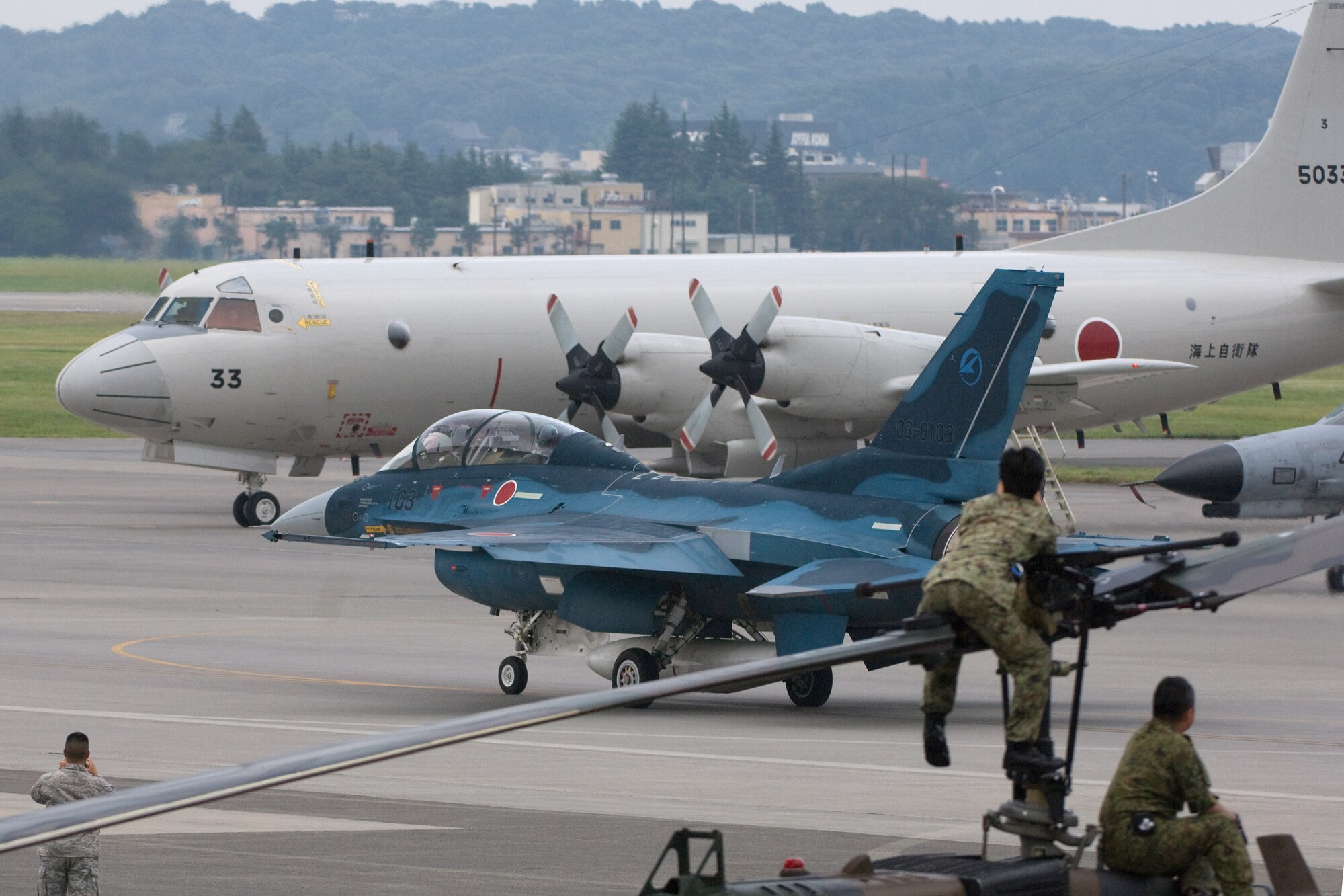YOKOTA AIR BASE, Japan -- A Mitsubishi F-2B from the Japan Air Self-Defense Force at Kagamigahara Air Base, Japan, departs the 2009 Yokota Air Base Japanese-American Friendship Festival Aug. 23. More than 170,000 people attended the two-day event. In addition to static displays and live music, the festival offered a variety of American and Japanese food items. The festival is designed to bolster the bi-lateral relationship shared by the United States and Japan. (U.S. Air Force photo/Osakabe Yasuo)