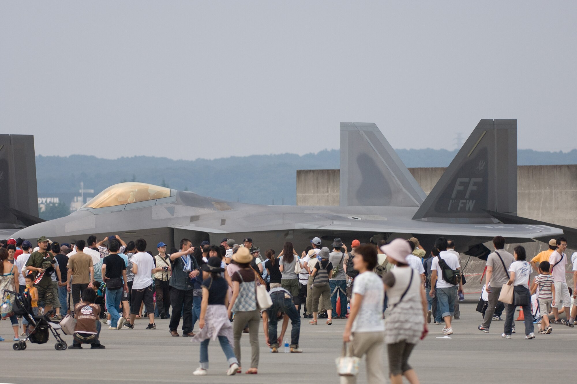 YOKOTA AIR BASE, Japan -- More than 170,000 people attended the two-day 2009 Yokota Air Base Japanese-American Friendship Festival Aug. 22-23. The main attraction was two F-22 Raptors from the 94th Fighter Squadron "Hat in the Ring Gang" at Langley Air Force Base, Va. In addition to static displays and live music, the festival offered a variety of American and Japanese food items. The festival is designed to bolster the bi-lateral relationship shared by the United States and Japan. (U.S. Air Force photo/Osakabe Yasuo)