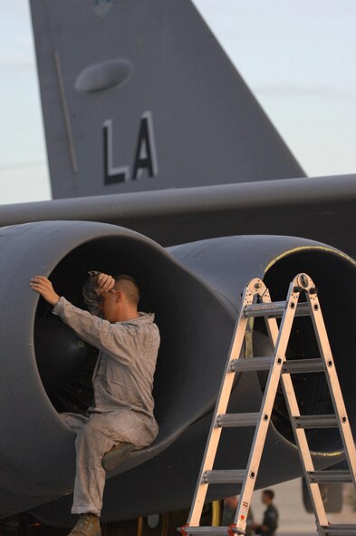 NELLIS AIR FORCE BASE, Nev. -- Staff Sgt. Wesley Cantrell, 2d Maintenance Squadron, performs post flight maintenance on a B-52 assigned to the 20th Bomb Squadron, Barksdale Air Force Base, La. The B-52s arrived at Nellis AFB, Nev., Aug 21 to participate in Red Flag 09-5, an intense two-week combat scenario exercise.  Red Flag is conducted on the 15,000-square-mile Nevada Test and Training Range, north of Las Vegas. The exercise is one of a series of advanced training programs administered by the U.S. Air Force Warfare Center and Nellis, through the 414th Combat Training Squadron. (U.S. Air Force photo by Staff Sgt. Sarah E. Stegman)(RELEASED)