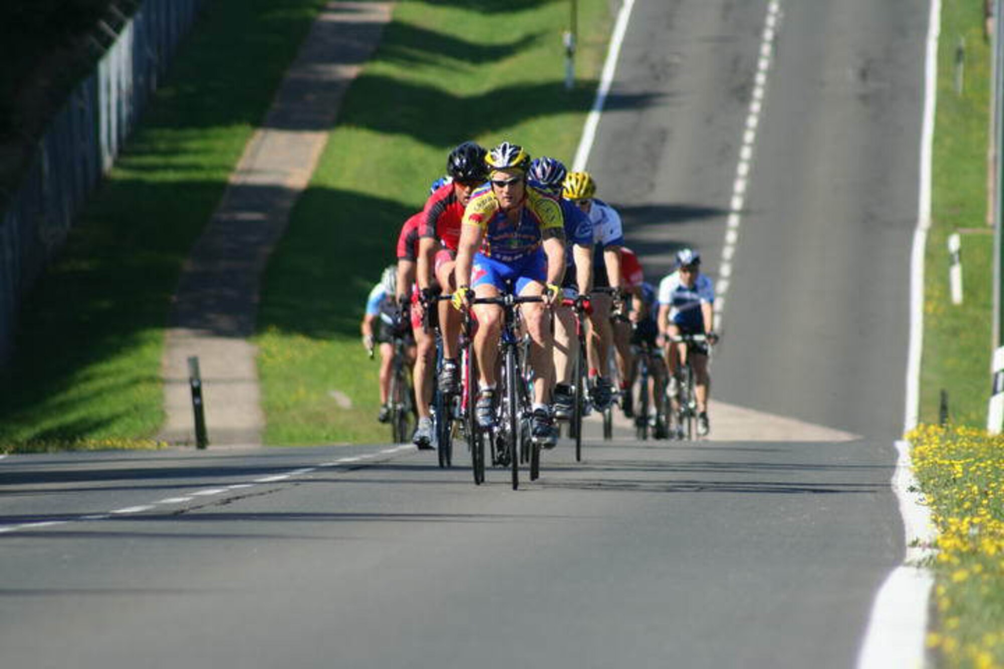 Master Sgt. Christopher Fritzsche, 31st Civil Engineer Squadron firefighter, leads a pack of 33 cyclists on lap three of the Eifel Classic 2009 held at Spangdahlem Air Base, Germany, Aug. 15.  Sergeant Fritzsche placed third overall and second for the men's senior category.  The race is part of the 2009 U.S. Forces Europe Road Cycling Series.  The 50-kilometer course for men and 30K course for women took riders around the the perimeter road of Spangdahlem AB.  (Courtesy photo)