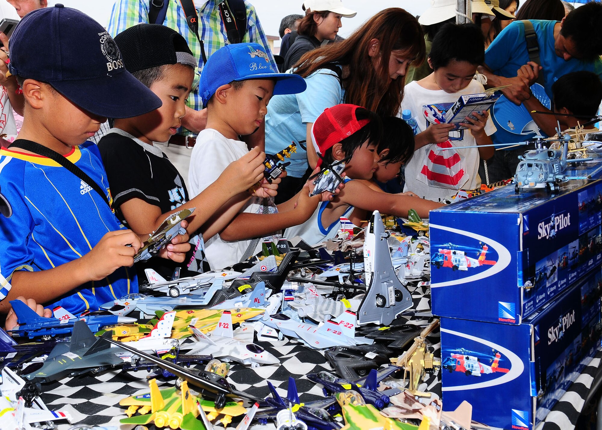 YOKOTA AIR BASE, Japan -- Japanese children check out model airplanes during the 2009 Yokota Air Base Japanese-American Friendship Festival Aug. 23. More than 170,000 people attended the two-day event. In addition to static displays and live music, the festival offered a variety of American and Japanese food items. The festival is designed to bolster the bi-lateral relationship shared by the United States and Japan.(U.S. Air Force photo/Airman 1st Class Sean Martin)