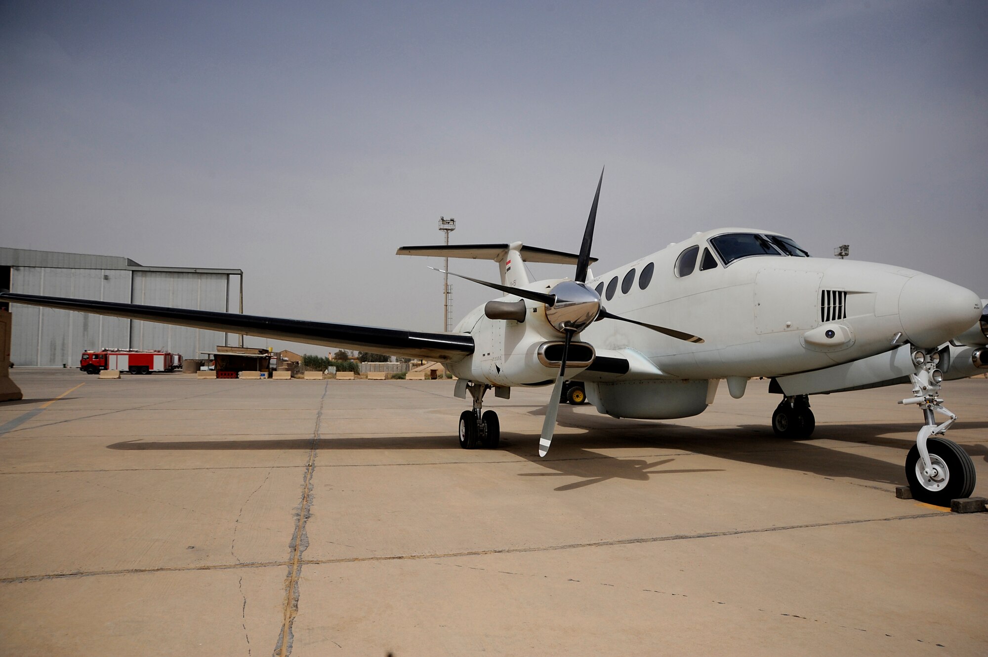 An Iraqi Air Force King Air 350 sits on the airfield at Al Muthana Air Base, Iraq, May 8. The airplane is assigned to the Iraqi Air Force's King Air Squadron 87 and boasts the intelligence, surveillance and reconnaissance capabilities necessary for the detection and deterrence of insurgent activity. (U.S. Air Force Photo by Staff Sgt. Shawn Weismiller/RELEASED)