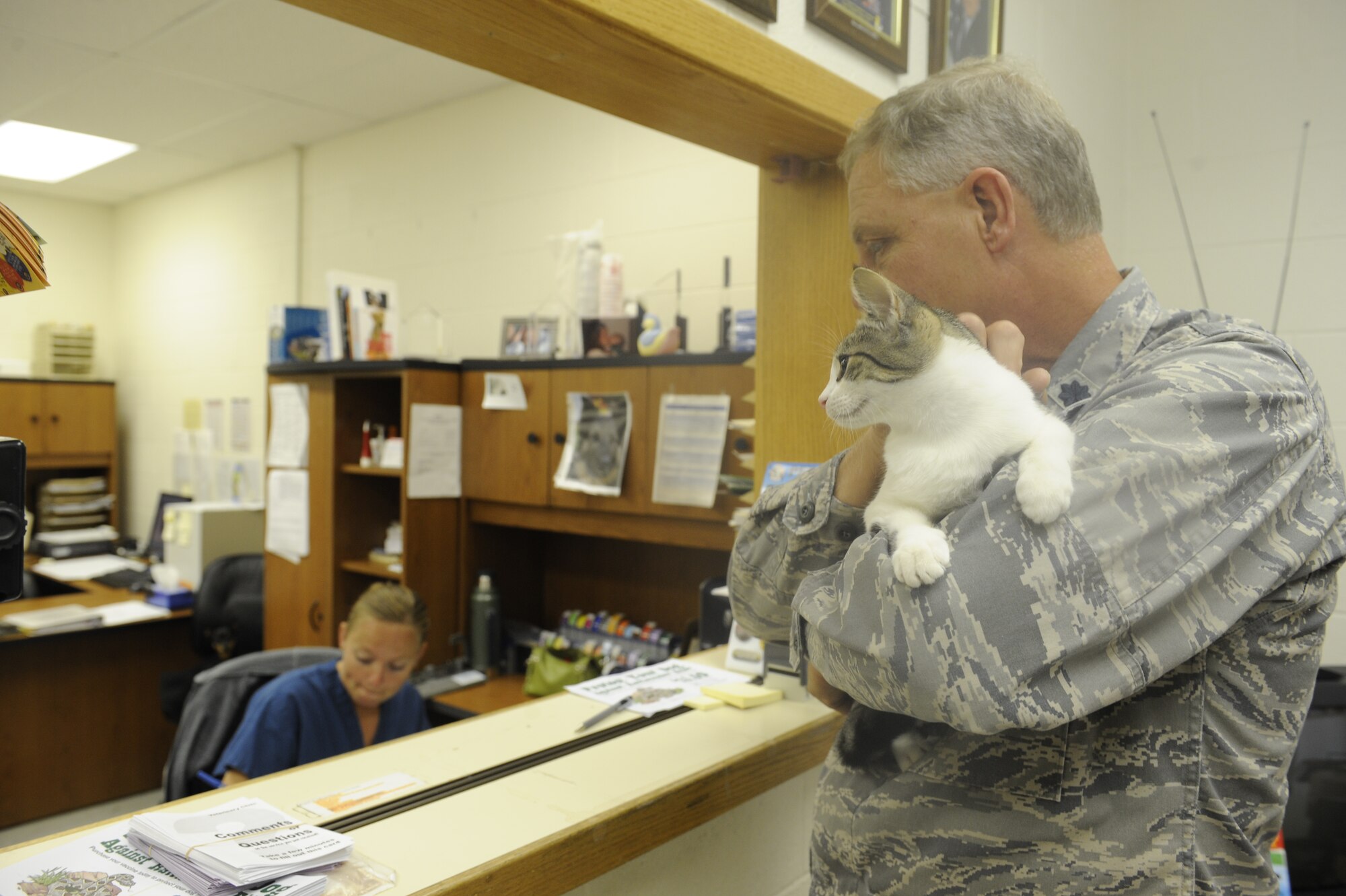 Lt. Col. Rory Adams, 28th Bomb Wing strategic arms reduction talks treaty officer, brings his cat Duncan, to the vet clinic here, August 20. The clinic performs routine checkups and vaccinations for many pets on and off base. (U.S. Air Force photo by Airman 1st Class Corey Hook)