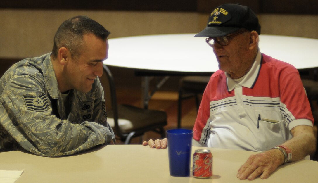 Tech. Sgt. Jason Weill, an evaluator for the 782nd Training Group, plays bingo with veterans Aug. 20 at the Veteran's Center in Lawton, Okla. Sheppard's Top-3 teamed up with their colleagues from Altus Air Force Base, Okla. to show veterans their service has not been forgotten when they visited the long-term nursing center. (U.S. Air Force photo/Tech. Sgt. Matthew Beauregard)