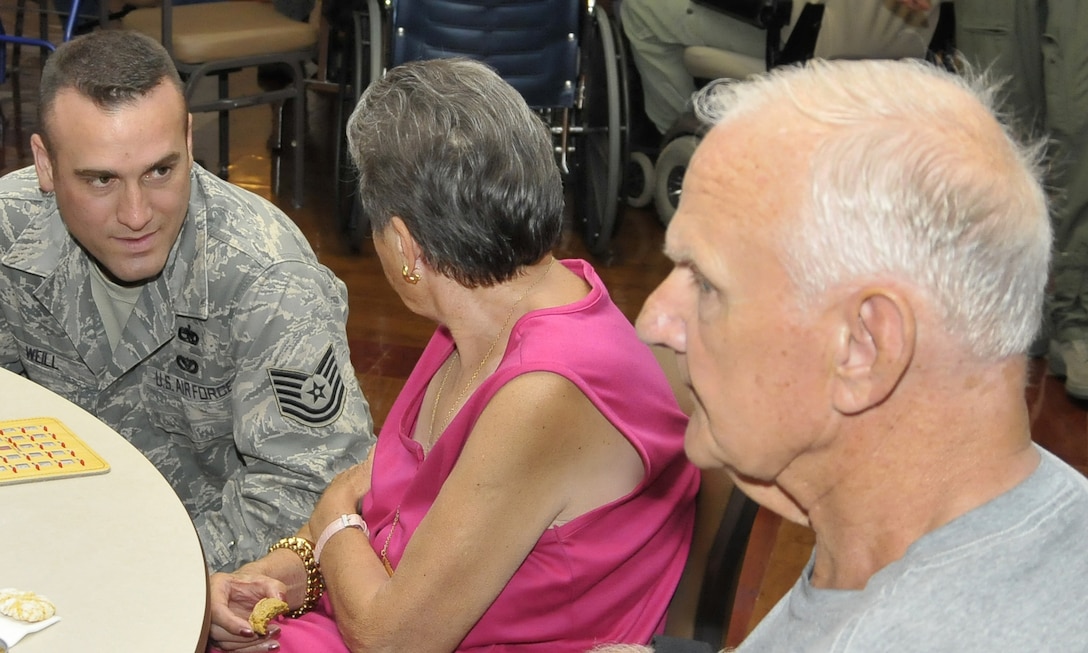 Tech. Sgt. Jason Weill, 782nd Training Group, plays bingo with military veterans Aug. 20 at the Veteran's Center in Lawton, Okla. Sheppard's Top-3 teamed up with their colleagues from Altus Air Force Base, Okla. to show veterans their service has not been forgotten when they visited the long-term nursing center. (U.S. Air Force photo/Tech. Sgt. Matthew Beauregard)