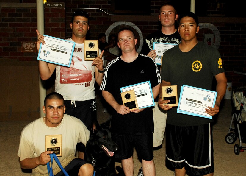 DYESS AIR FORCE BASE, Texas – The Dog Pound, Airmen from the 7th Security Forces Squadron, won 1st place in a Build-a-Boat contest here Aug. 21. The contestants had a little more than an hour to plan and complete their boats made out of cardboard. The contest is an annual hallmark event that the headquarters Air Force Services Agency and 7th Force Support Squadron support. (U.S. Air Force photo by Airman 1st Class Chelsea L. Browning)
