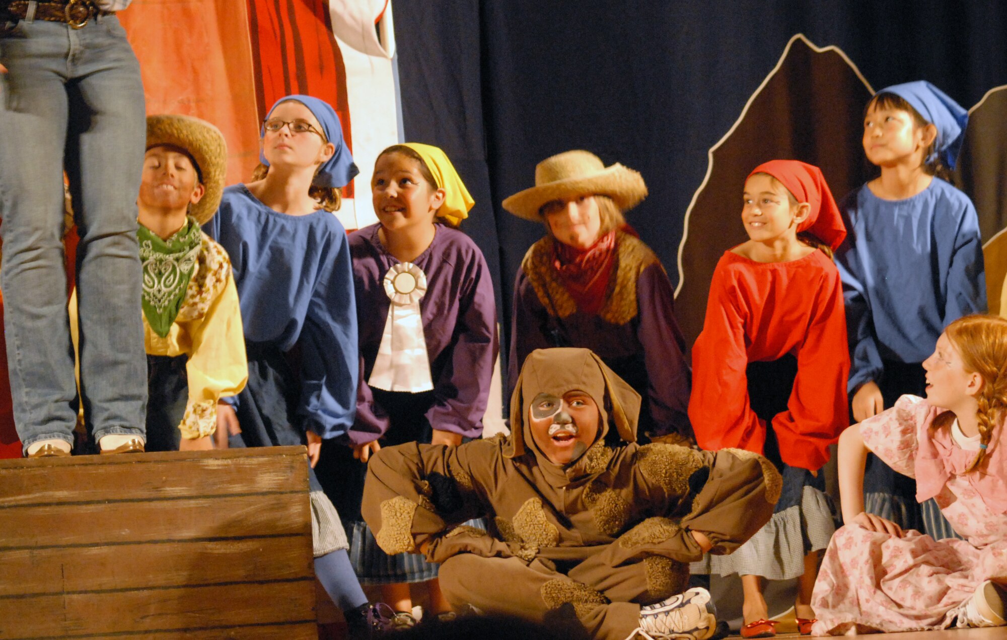 Emily Lescarbeau, front center in make-up, along with other Goodfellow youth, performs in Beauty Lou and the Country Beast, at the Goodfellow AFB base theater Aug. 14.  The Missoula Children's Theatre provides a week-long performance workshop and rehearsals that culminate in two full-scale musical public performances starring almost 60 Goodfellow youth. (U.S. Air Force / Robert D. Martinez)