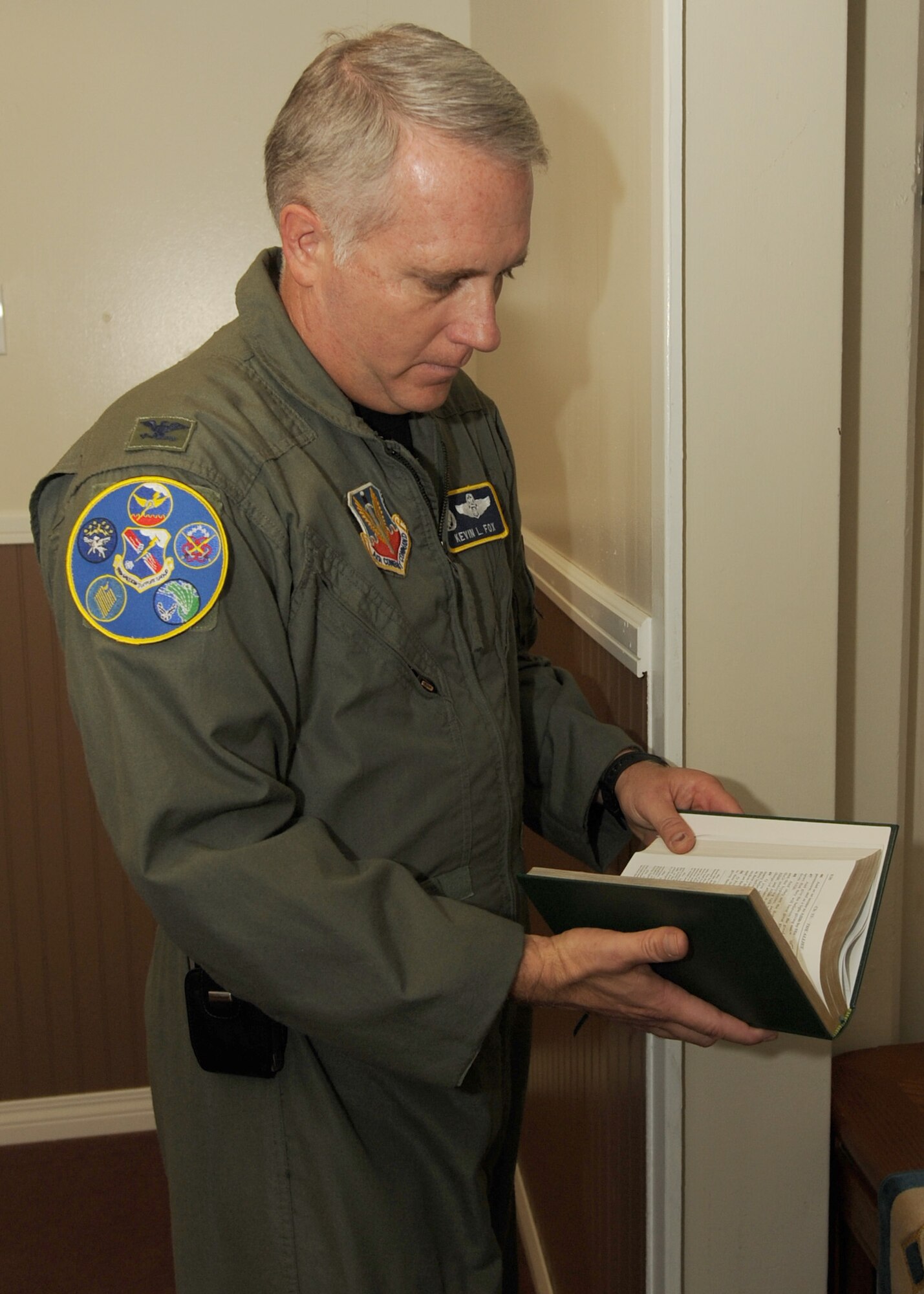 NELLIS AIR FORCE BASE NEV.,-- Colonel Kevin Fox, Commander of the 99th Mission Support Group, reads pages from the Qu'ran, the Muslim holy book, at the Base Chapel on August 21, 2009. The Neliis AFB Chapel opened a new prayer room dedicated to the Muslim faith, providing muslim servicemembers a place to worship during the Muslim holy season of Ramadan.
(U.S. Air Force Photo / Airman 1st Class Stephanie Rubi)