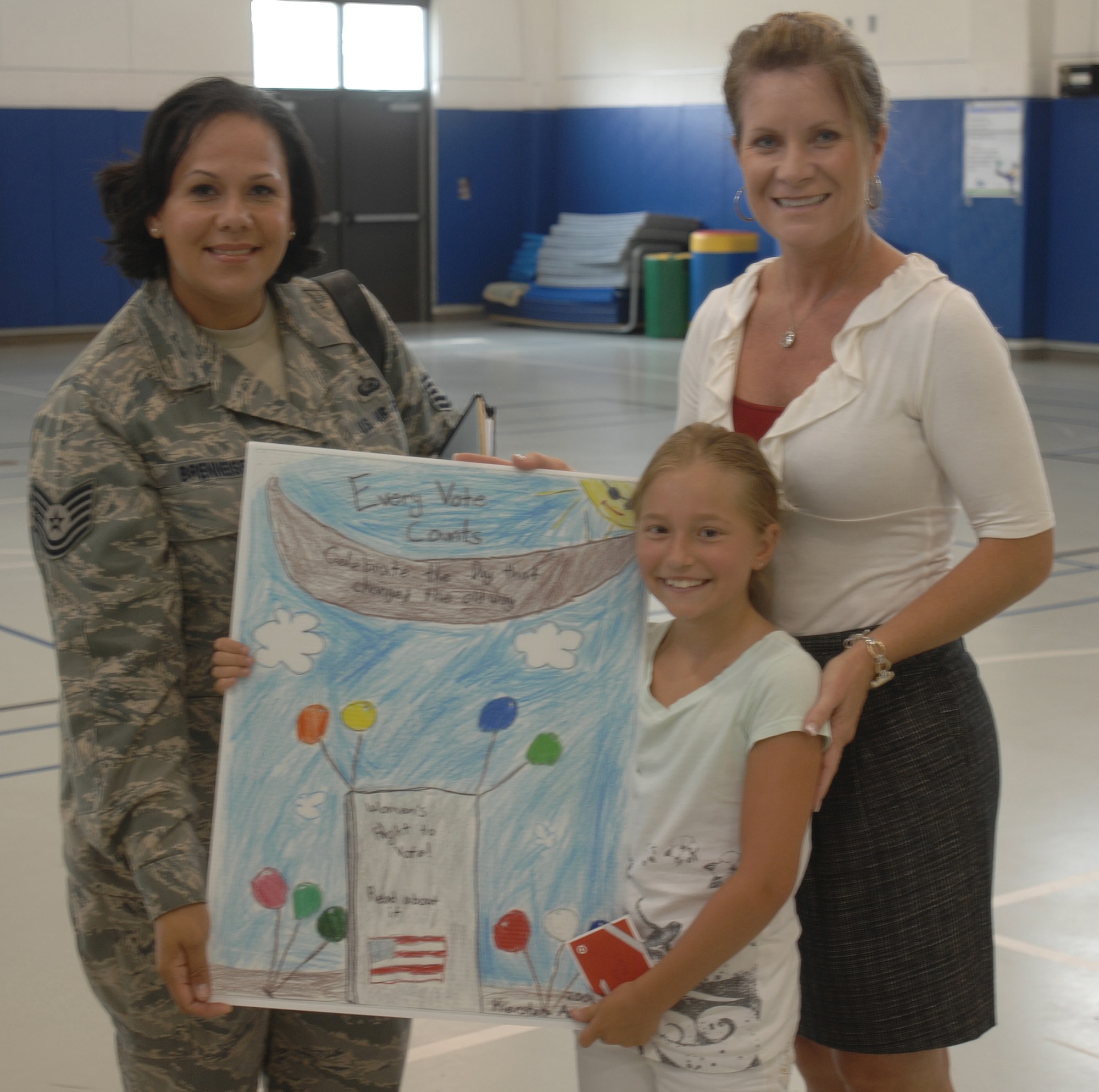 Nine-year-old Kiersten Aaberg displays her winning poster as part of the 2009 Women?s Equality Day drawing contest at the Hurlburt Youth Center. Aug. 26 is designated annually to observe the 1920 passage of the 19th Amendment to the Constitution, which gave women the right to vote. The passing of the amendment was a culmination of a civil rights movement by women. The movement officially began in 1848 at the first women?s rights convention held at Seneca Falls, N.Y. Today, Women?s Equality Day not only commemorates the passage of the 19th Amendment, it also calls attention to women?s continuing efforts toward full equality.